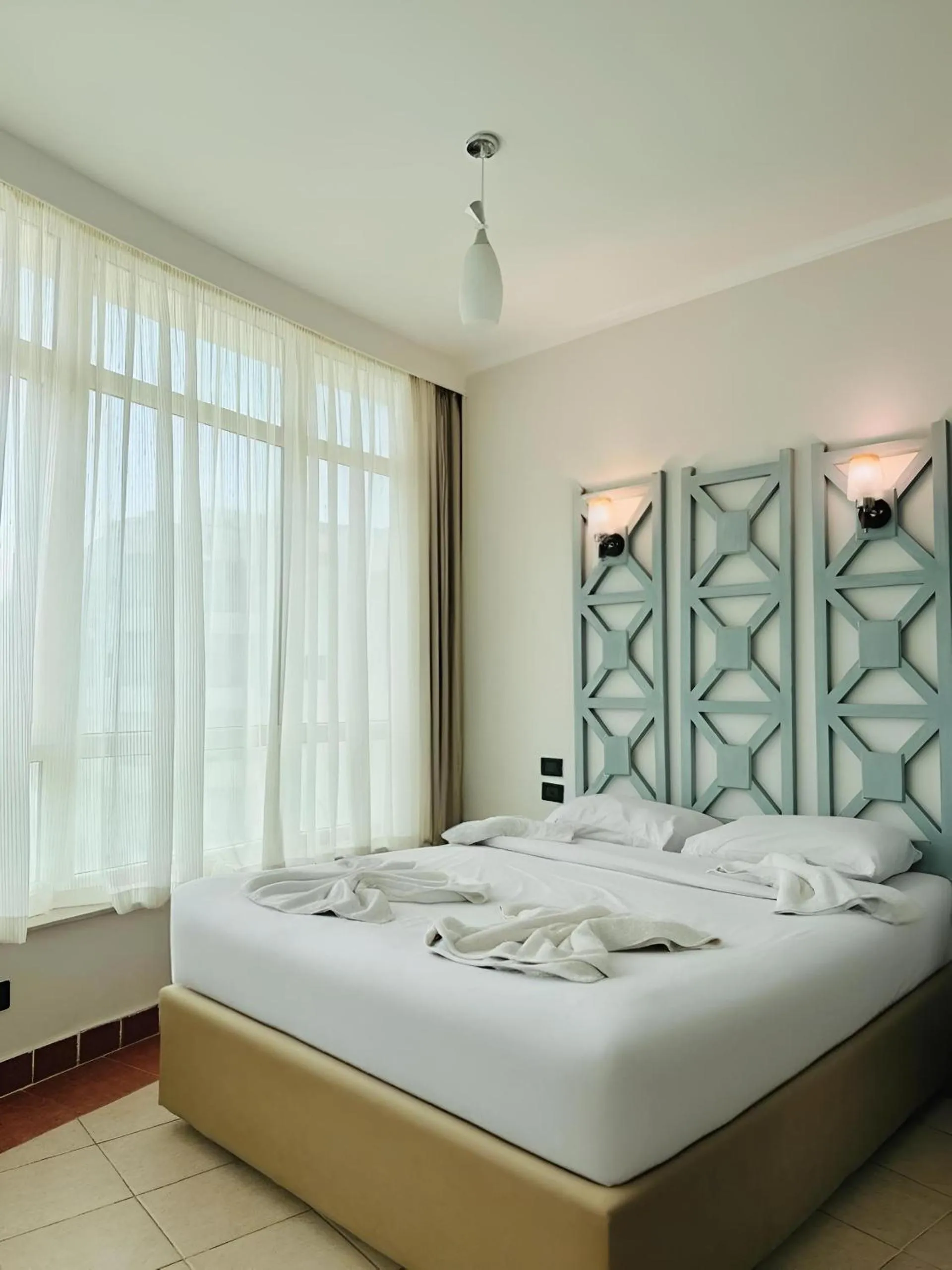 Bed in Royal Beach Serviced Apartments