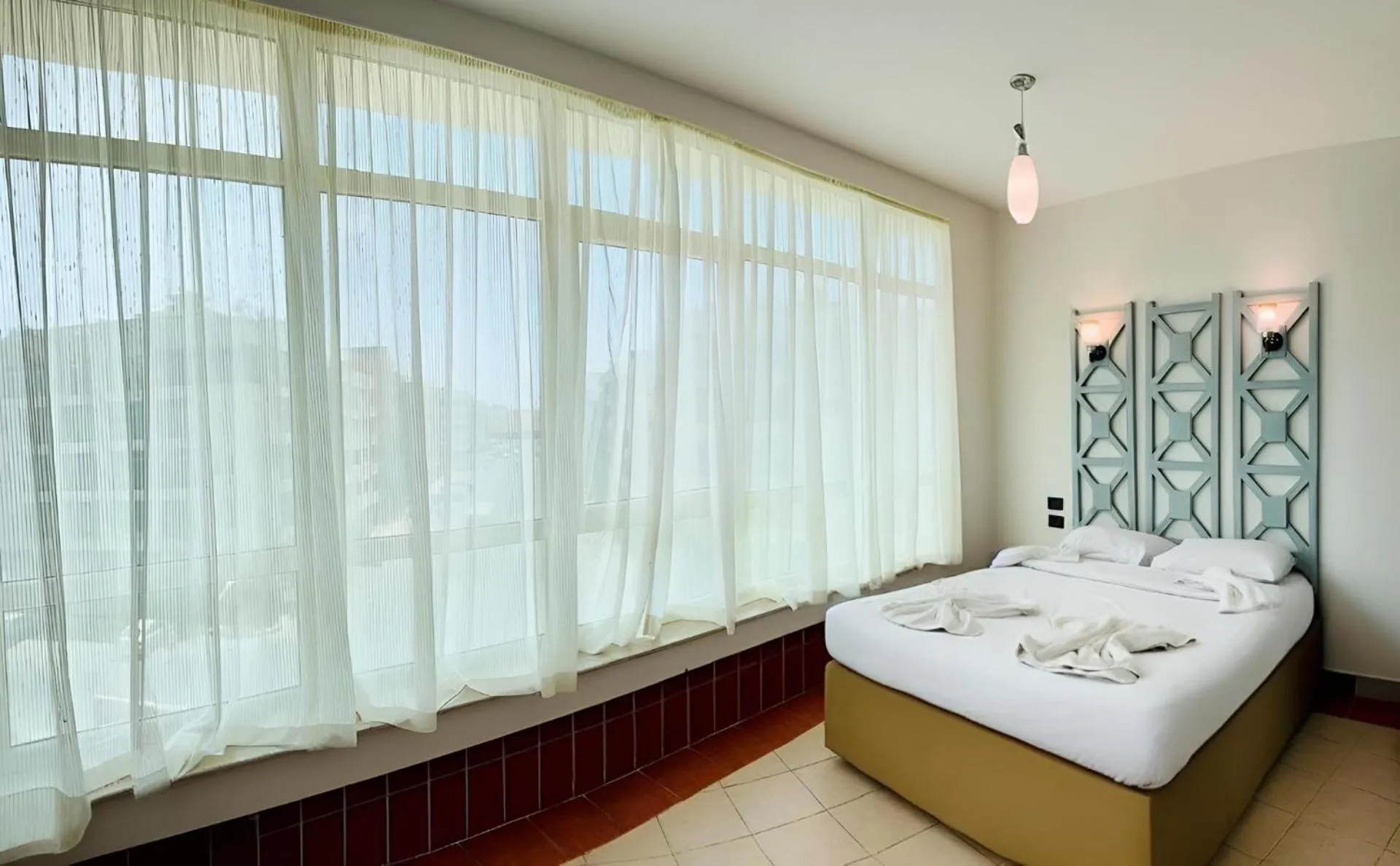 Bed in Royal Beach Serviced Apartments