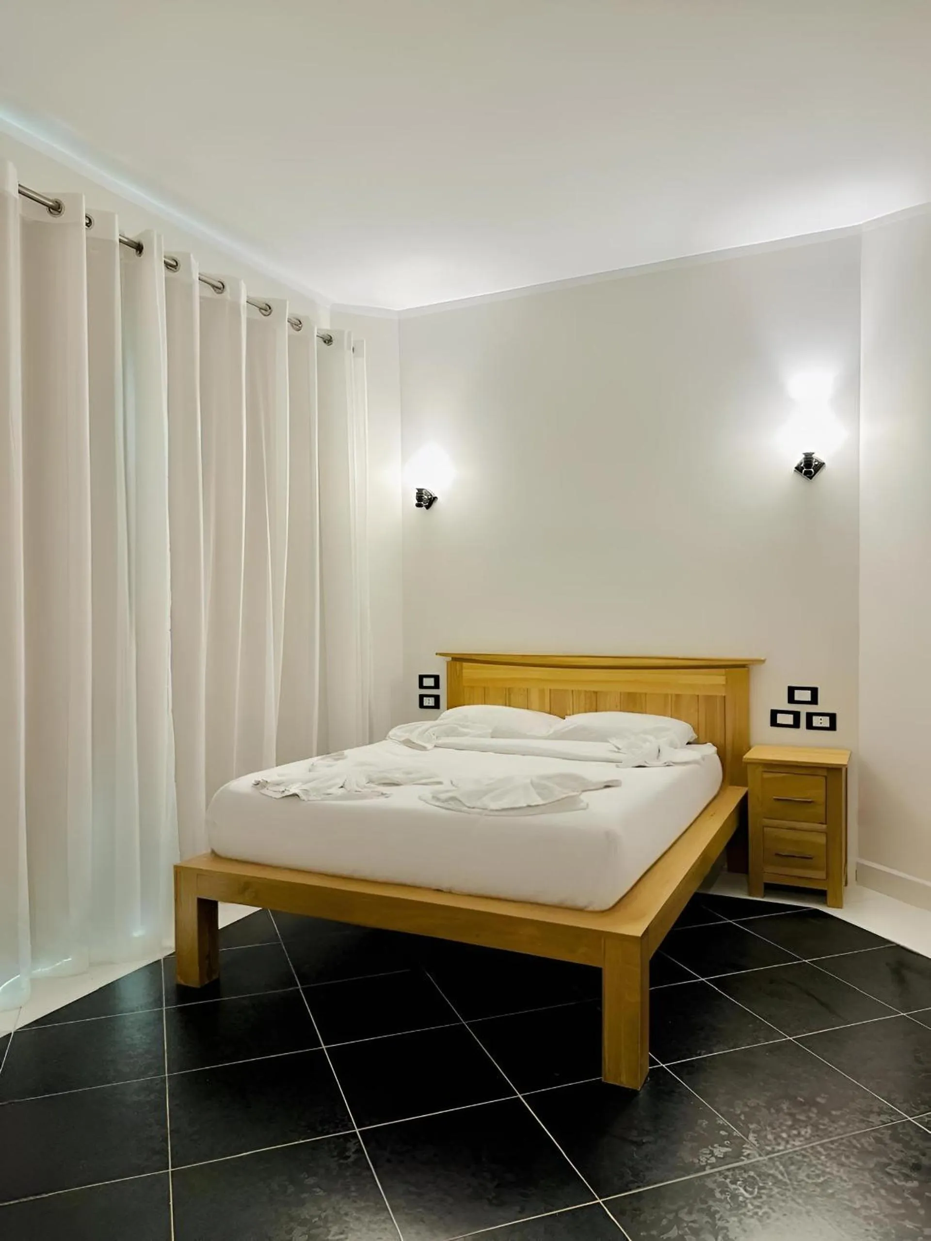 Bed in Royal Beach Serviced Apartments