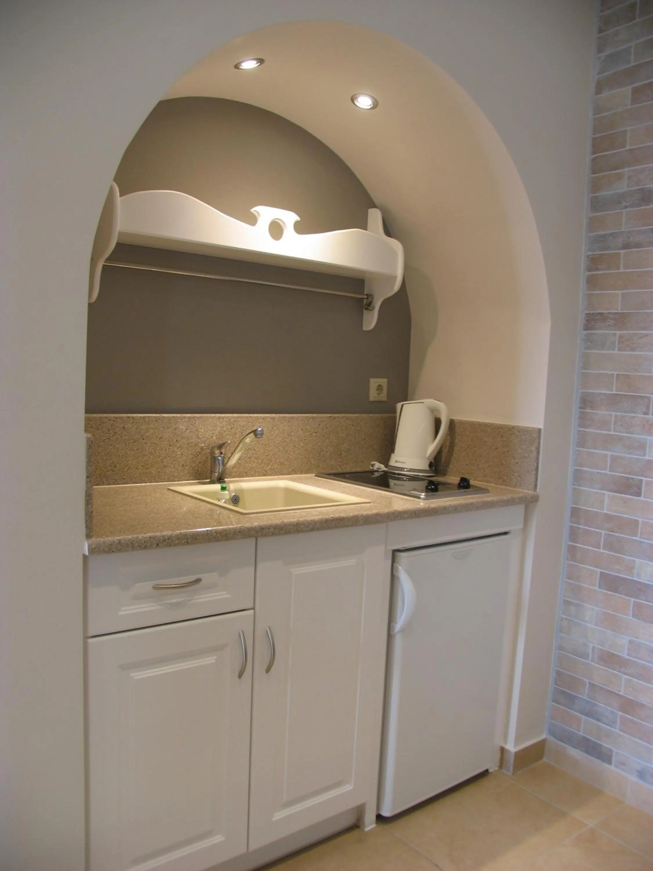 Kitchen or kitchenette in Anassa Deluxe Suites