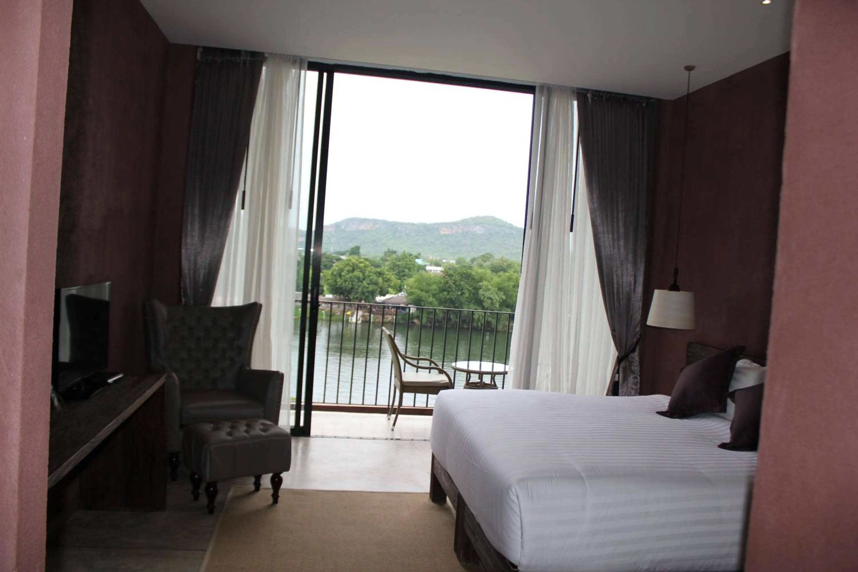 Bed in The Glory River Kwai Hotel