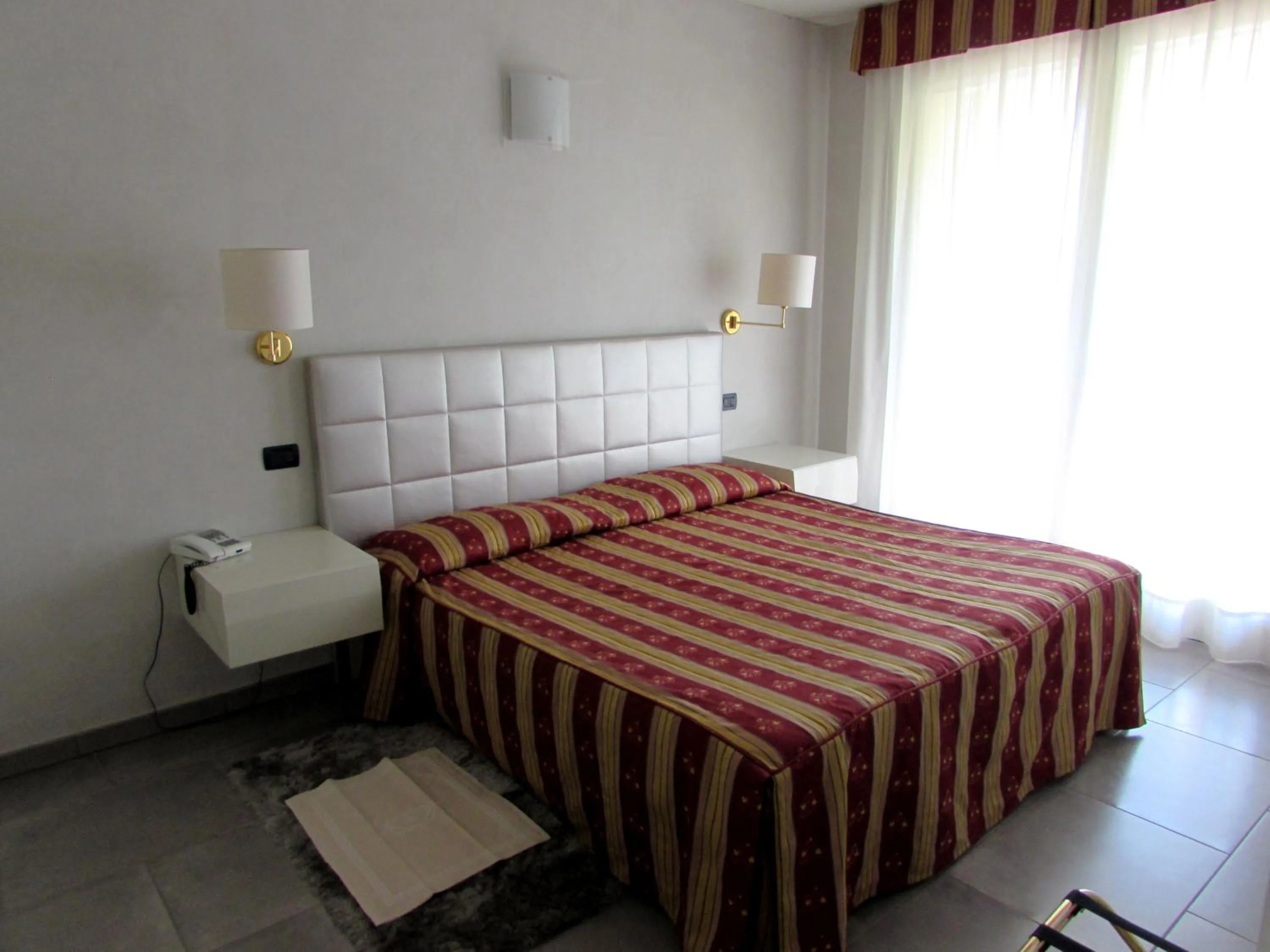 Bed in Hotel Dante Residence