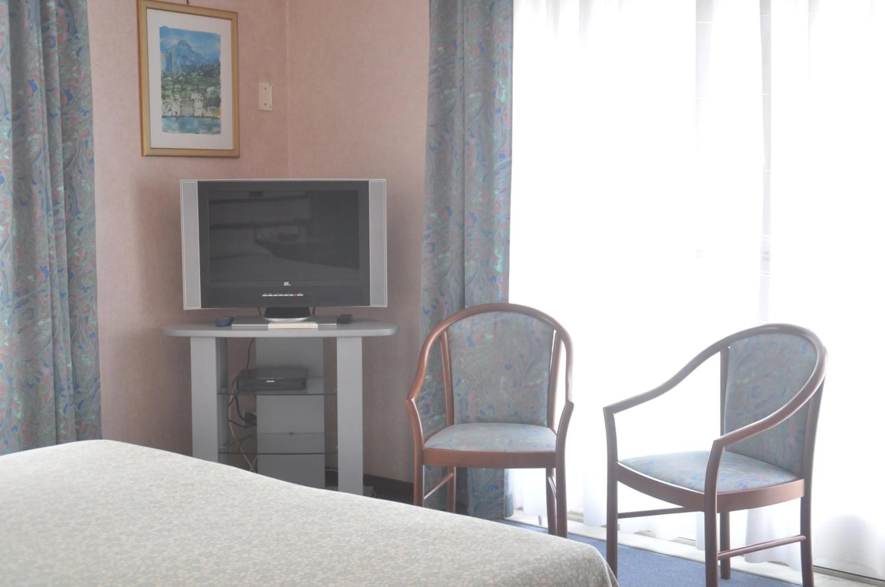 Seating area, Bed in Albergo Fiorenza