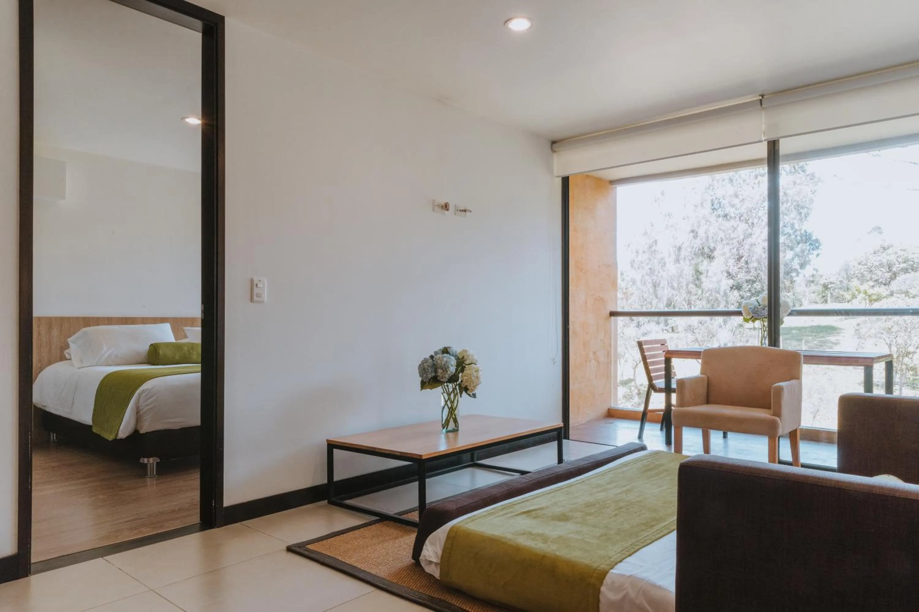 Living room, Bed in Travelers Rio Verde Living Suites