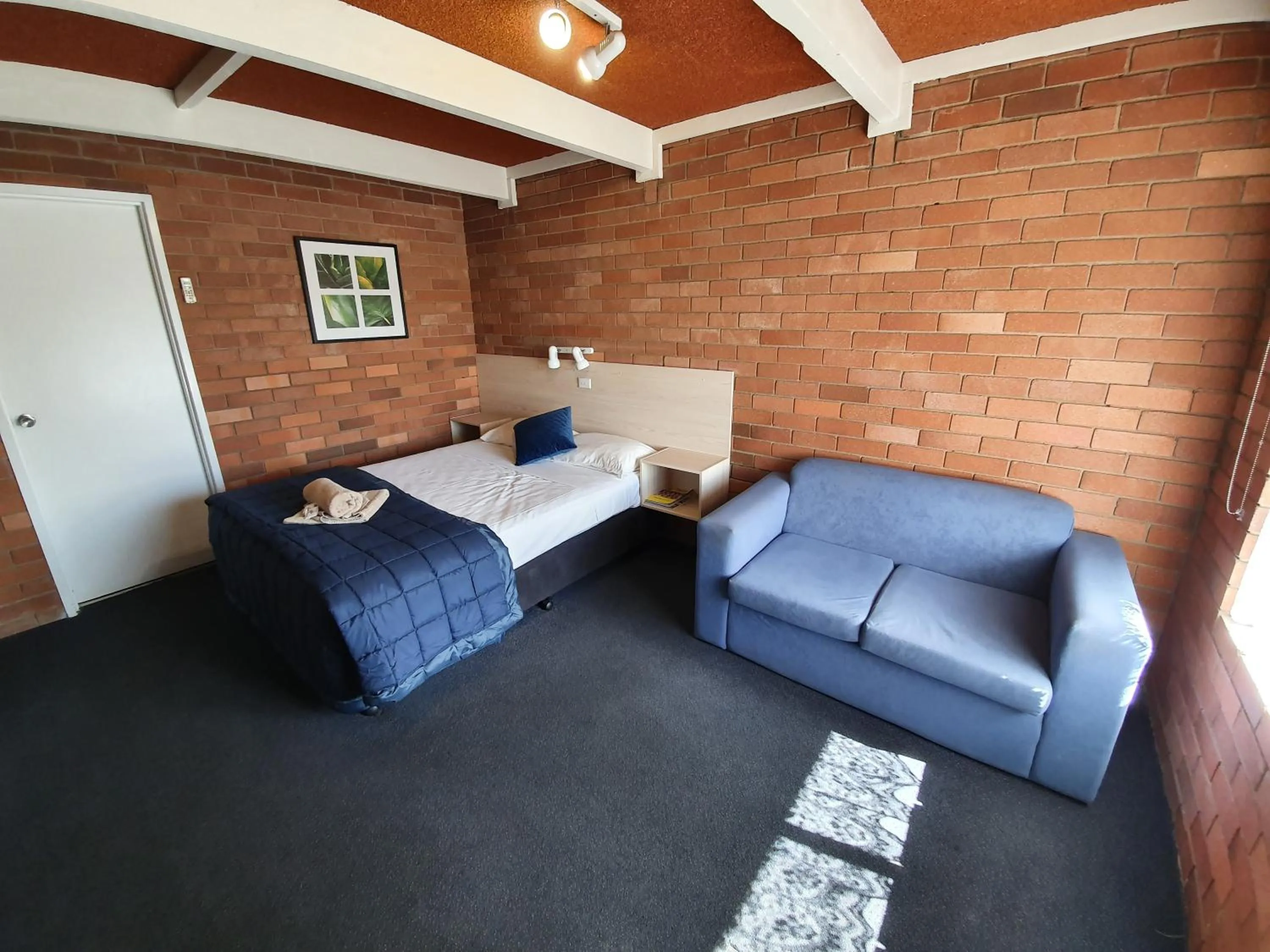 Photo of the whole room, Bed in Red Chief Motel