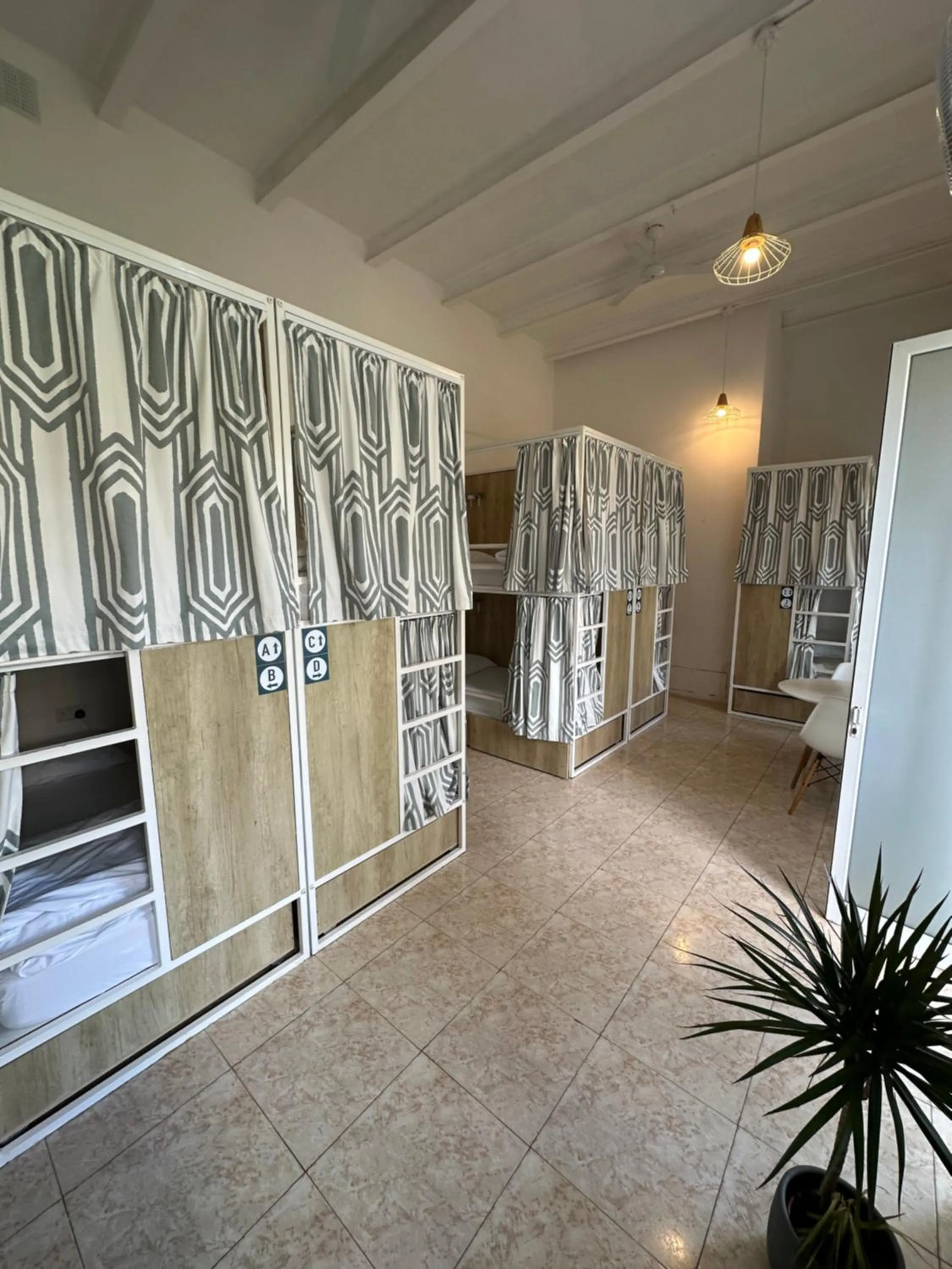 Bedroom in Follow the Sun Boutique Hostel - Pool, Breakfast & Sea Views