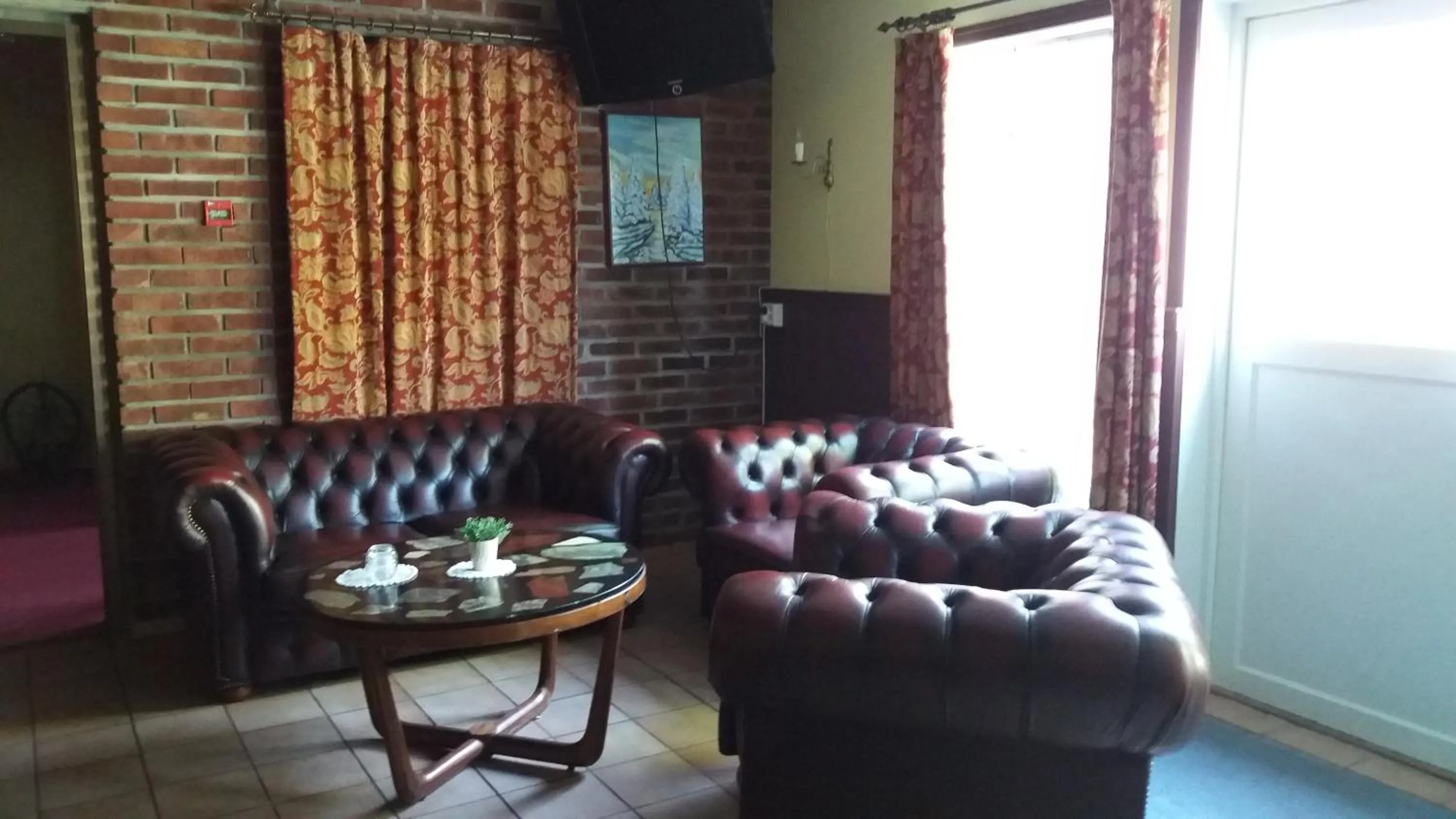 Communal lounge/ TV room in Askvoll Fjordhotell