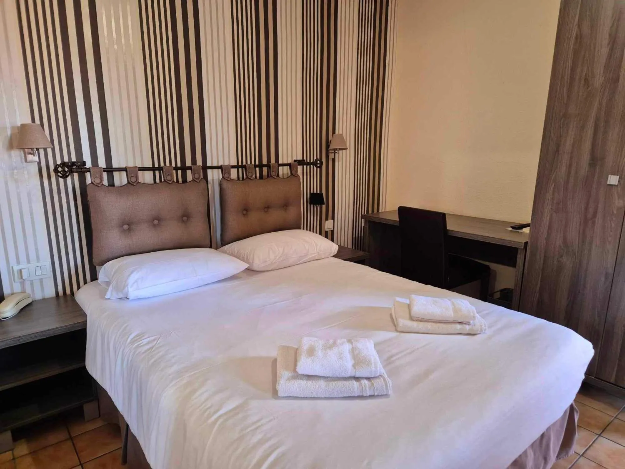 Bed in Logis Hôtel Le Mistral - Restaurant - Montélimar Sud