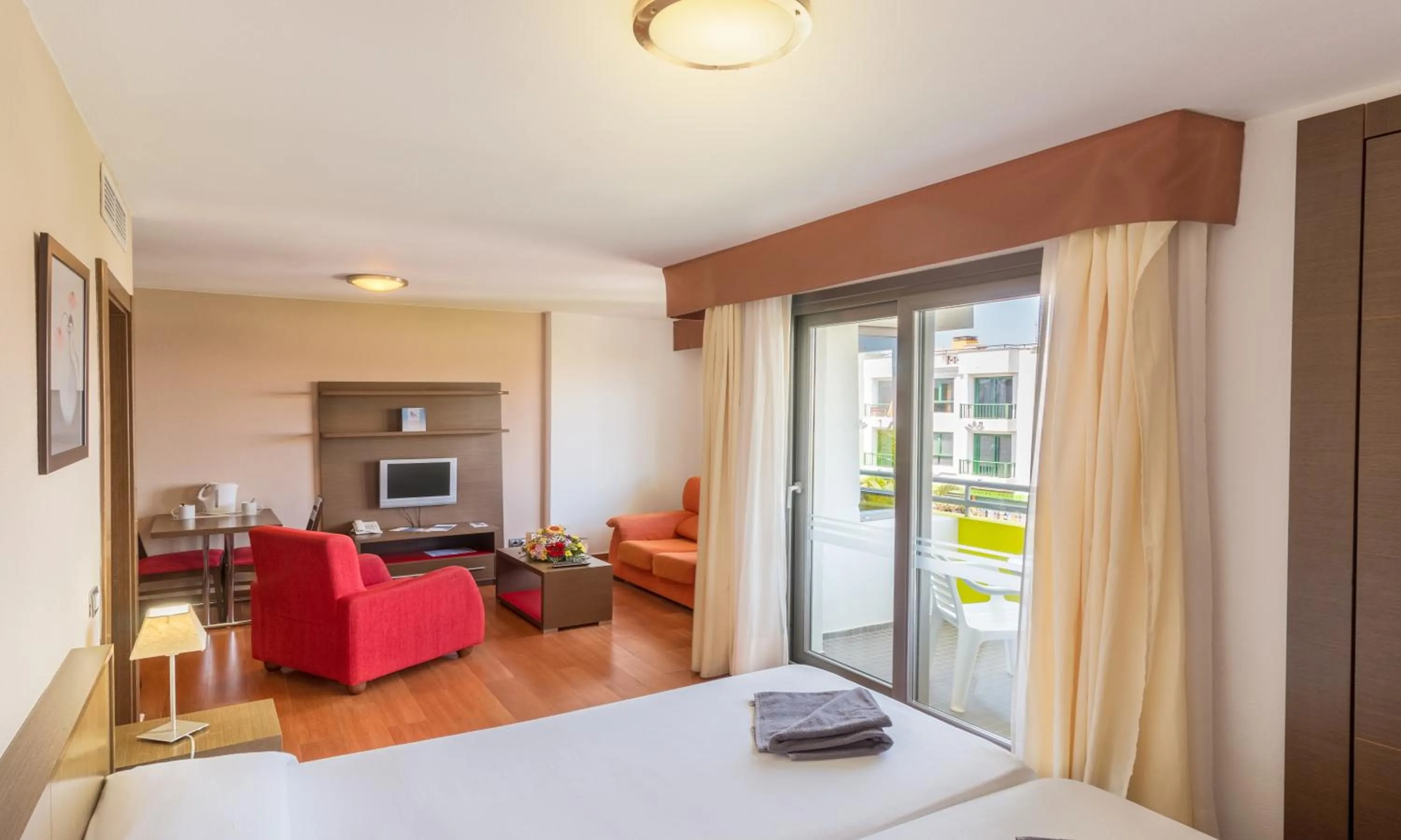 Living room, Bed in Hotel LIVVO Corralejo Beach