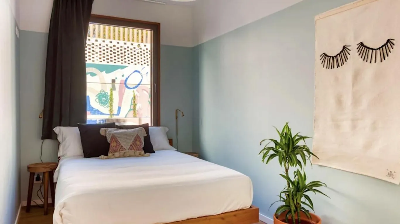 Bed in Selina Secret Garden Lisbon by IKIGAI Global Hospitality