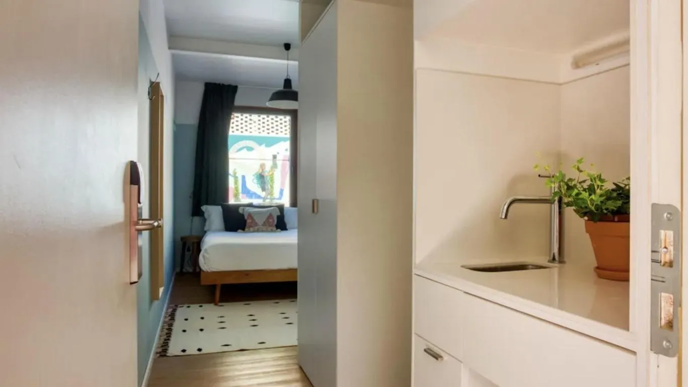 Bed in Selina Secret Garden Lisbon by IKIGAI Global Hospitality