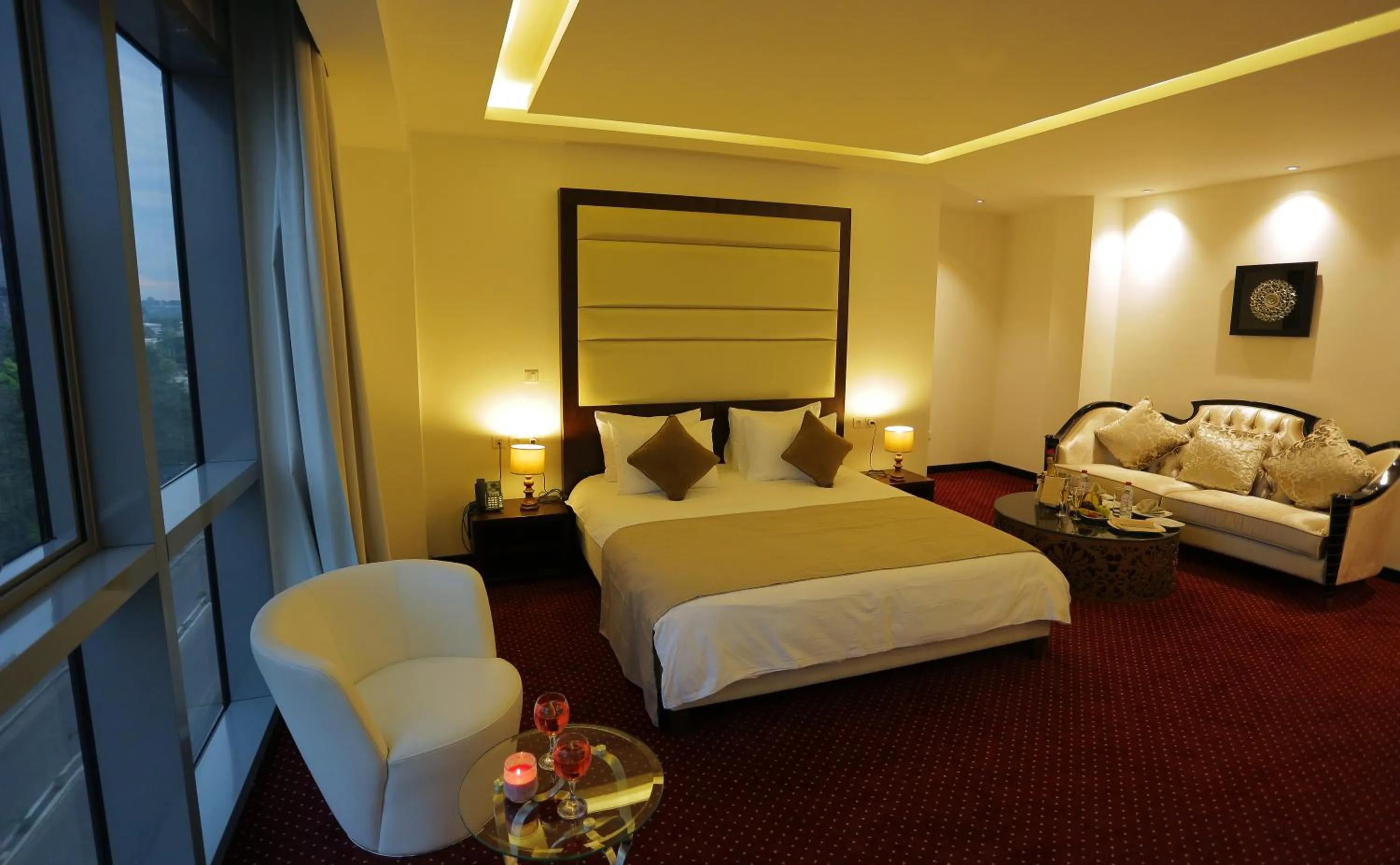 Seating area, Bed in GHS Hotel