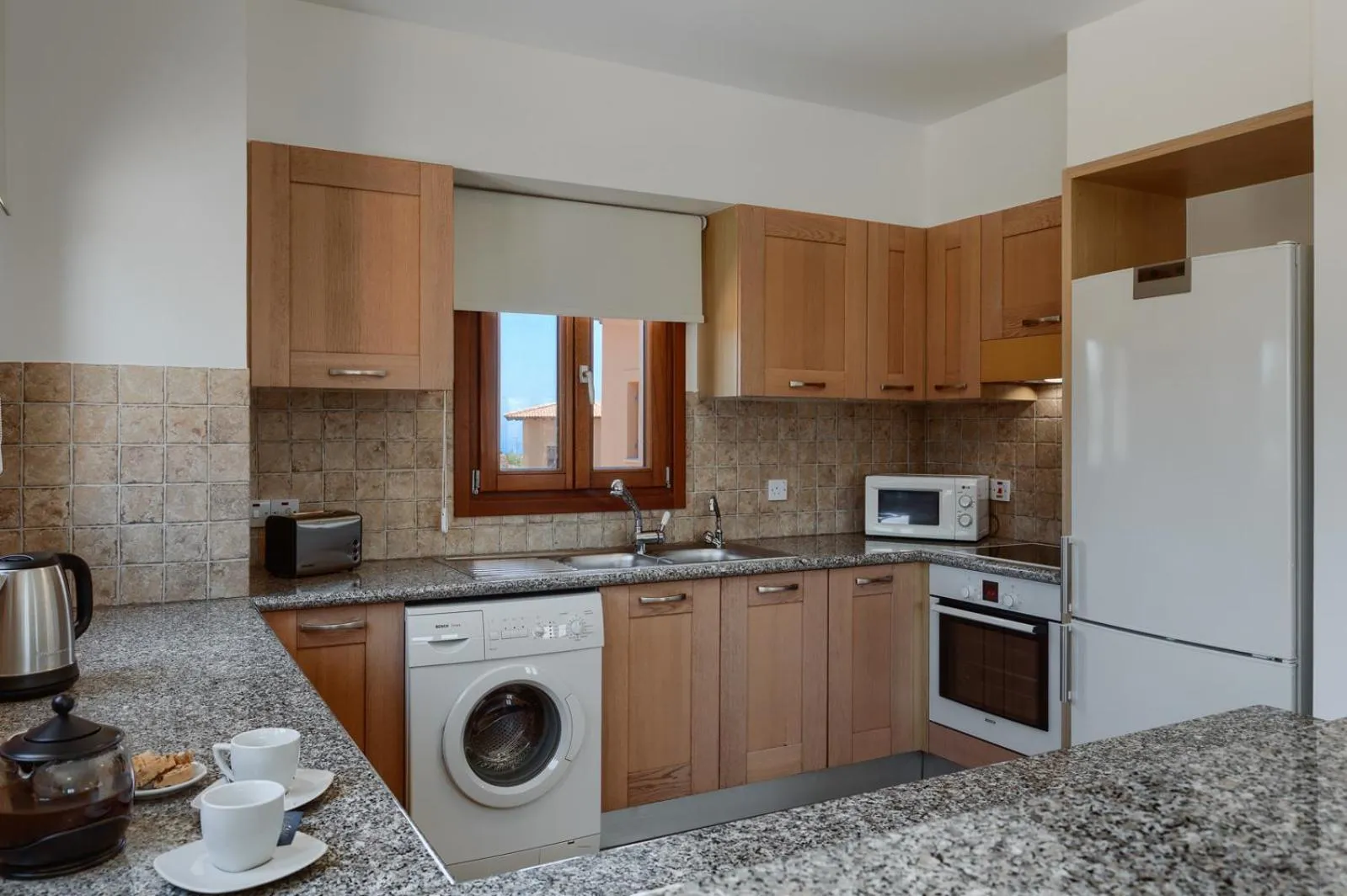 Kitchen or kitchenette in Aphrodite Hills Rentals - Apartments