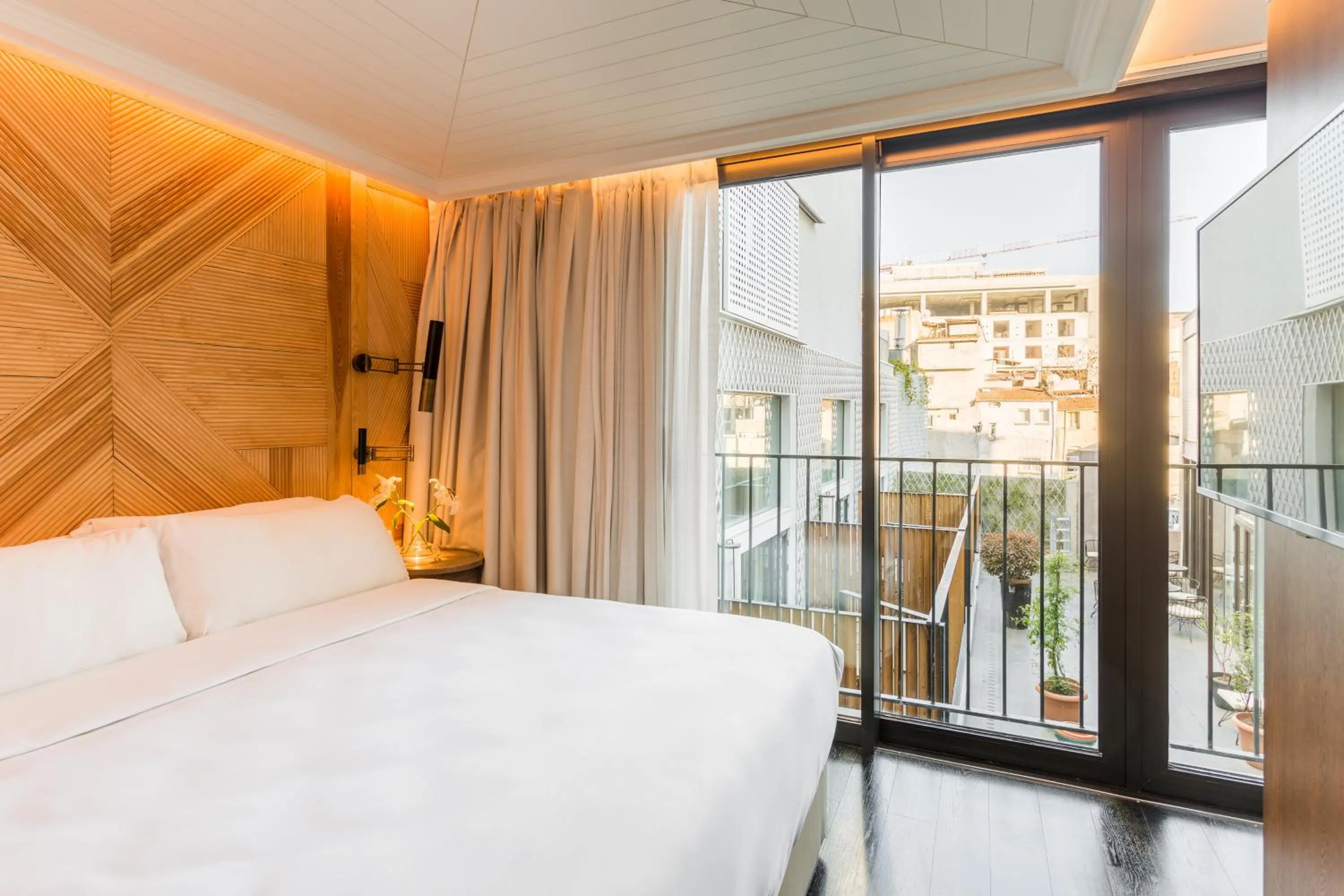 Bed in The Wings Hotels Collection