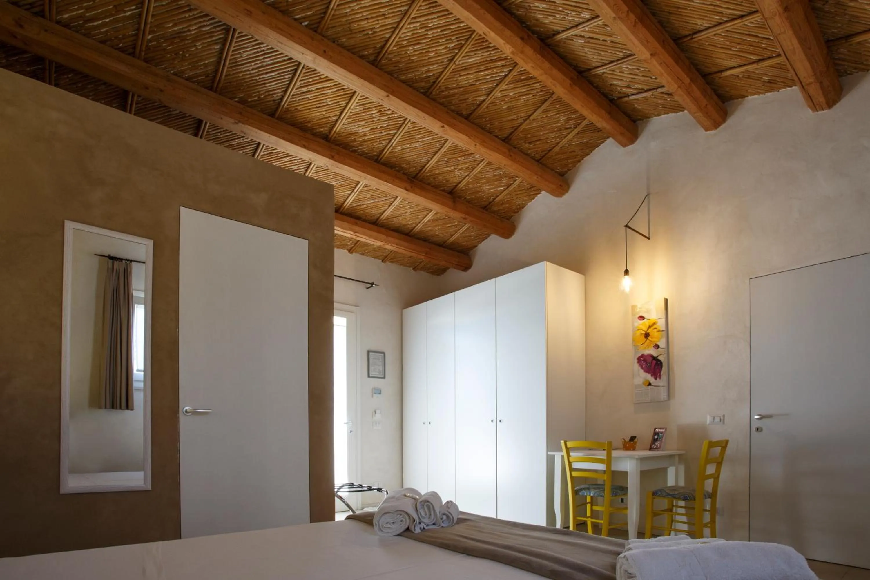 Seating area, Bed in Stacci Rural Resort