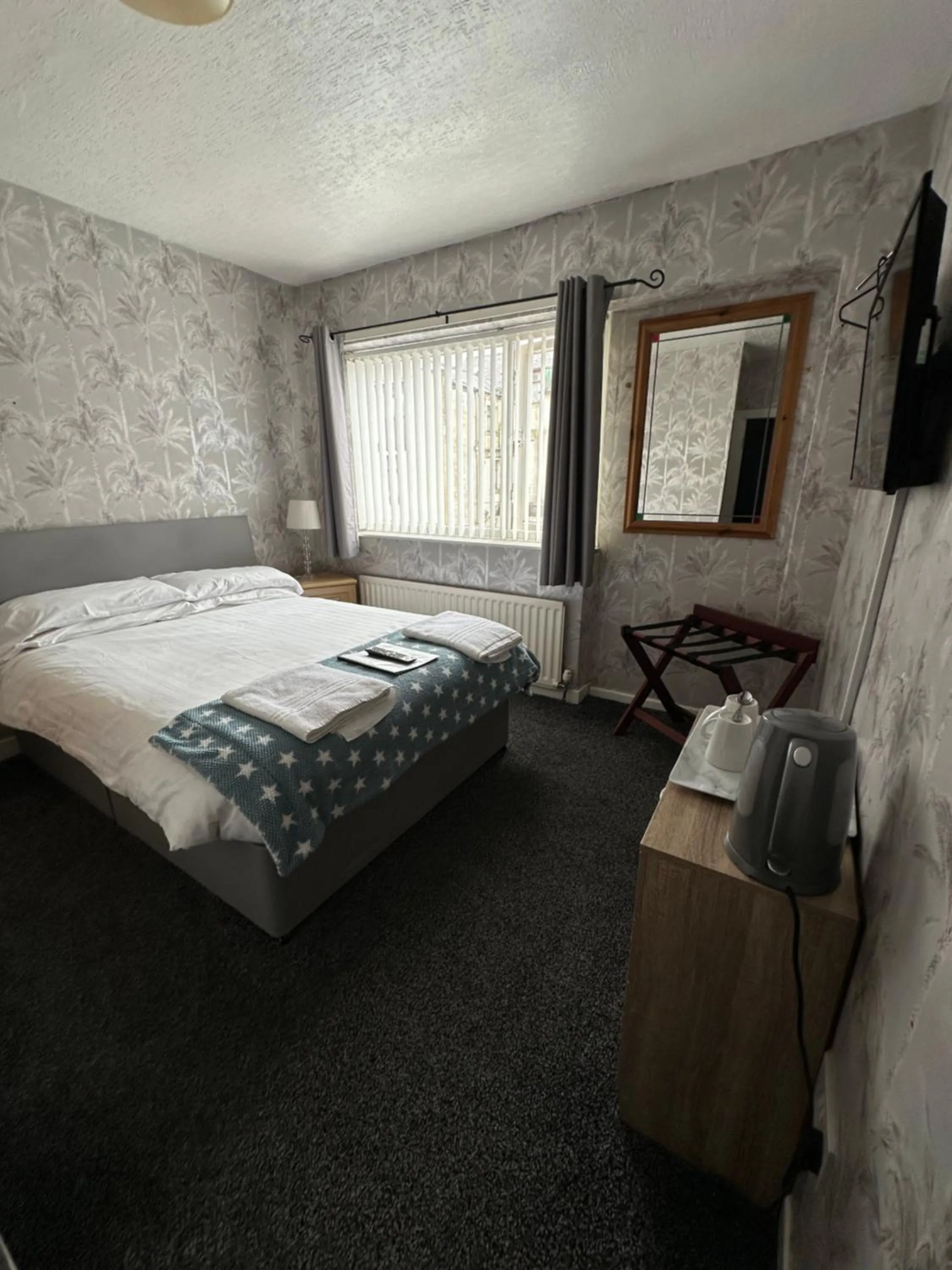 Bed in The Villa Hotel