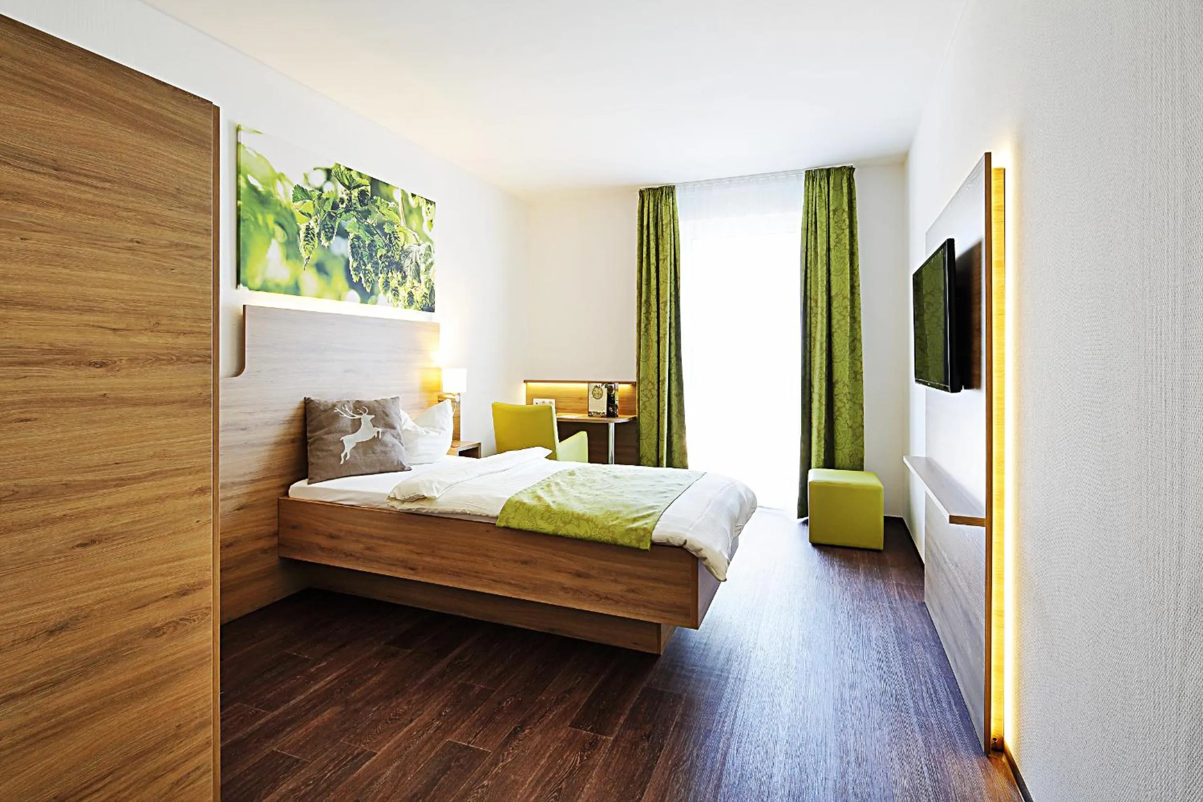 Photo of the whole room, Bed in Green Deer Bavarian Hotel