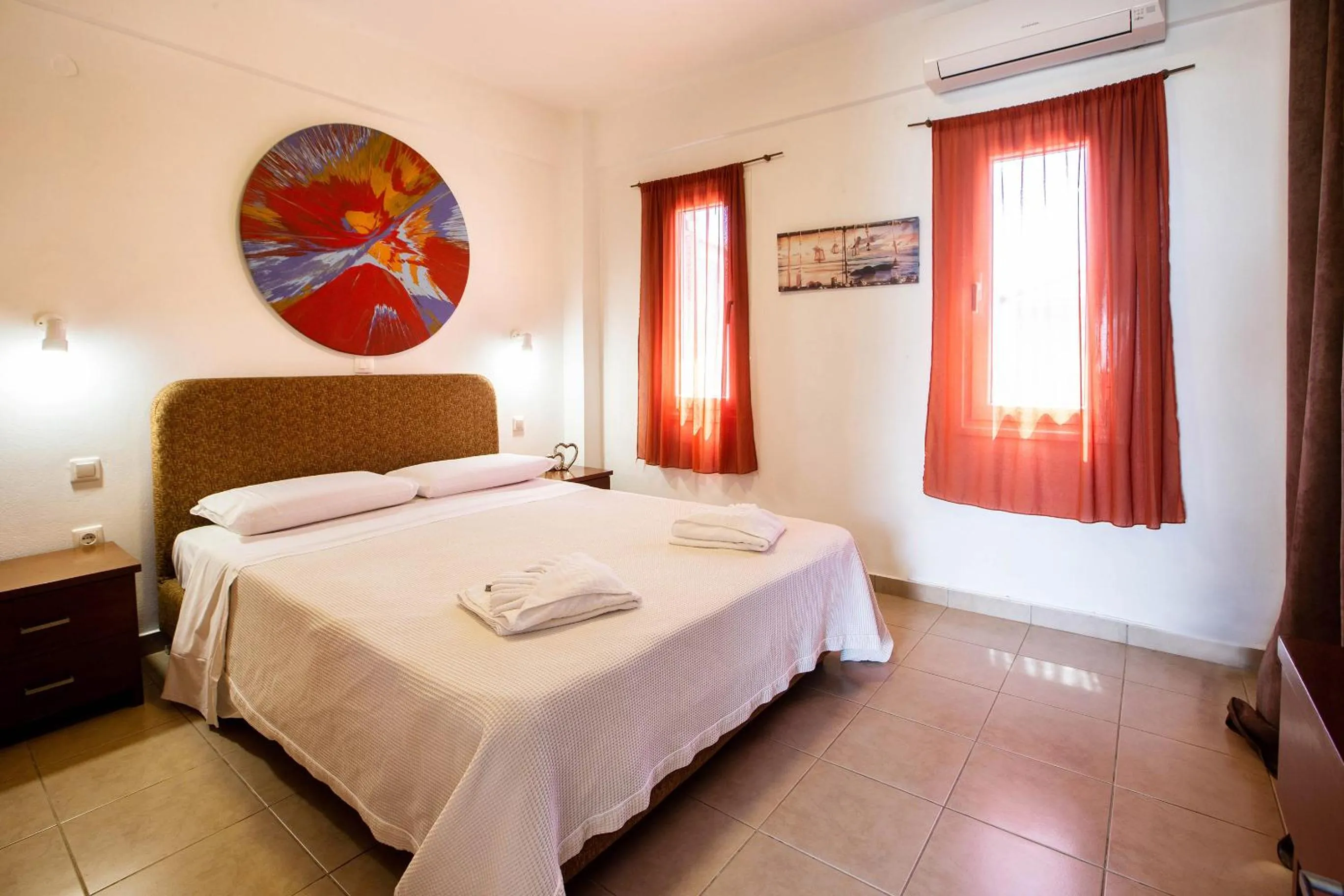 Bed in Romanos Beach Villas