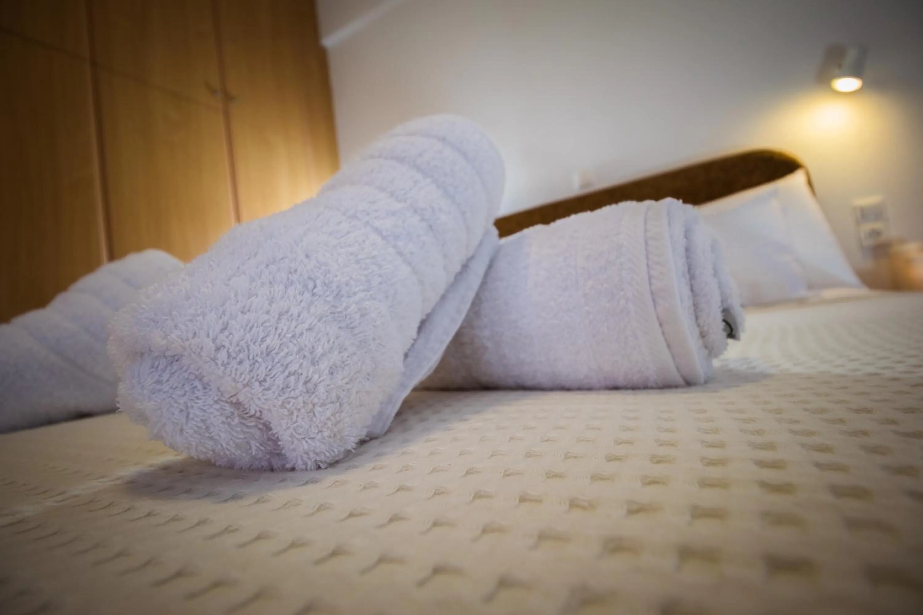 Bed in Romanos Beach Villas