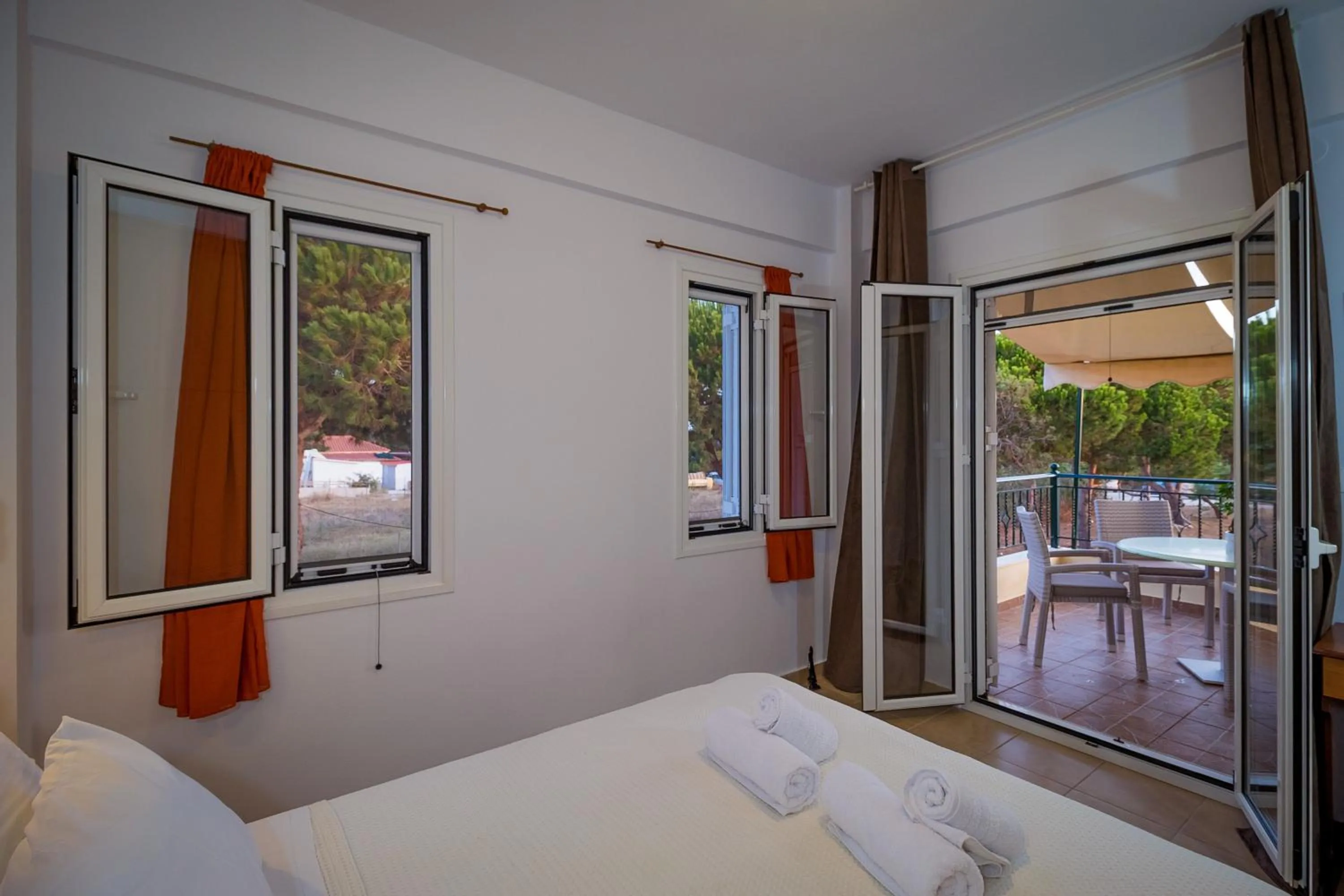 Bed in Romanos Beach Villas