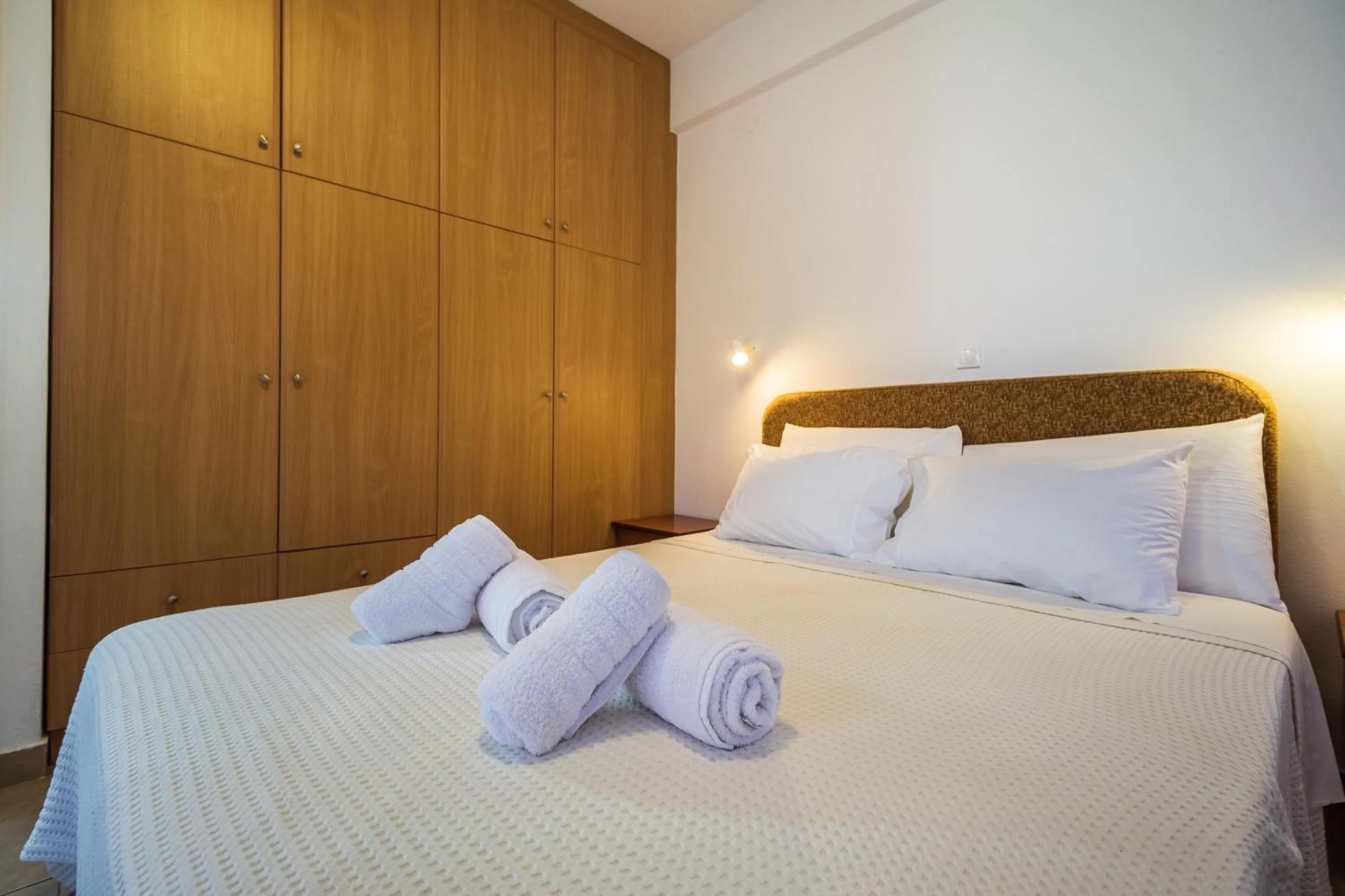 Bed in Romanos Beach Villas