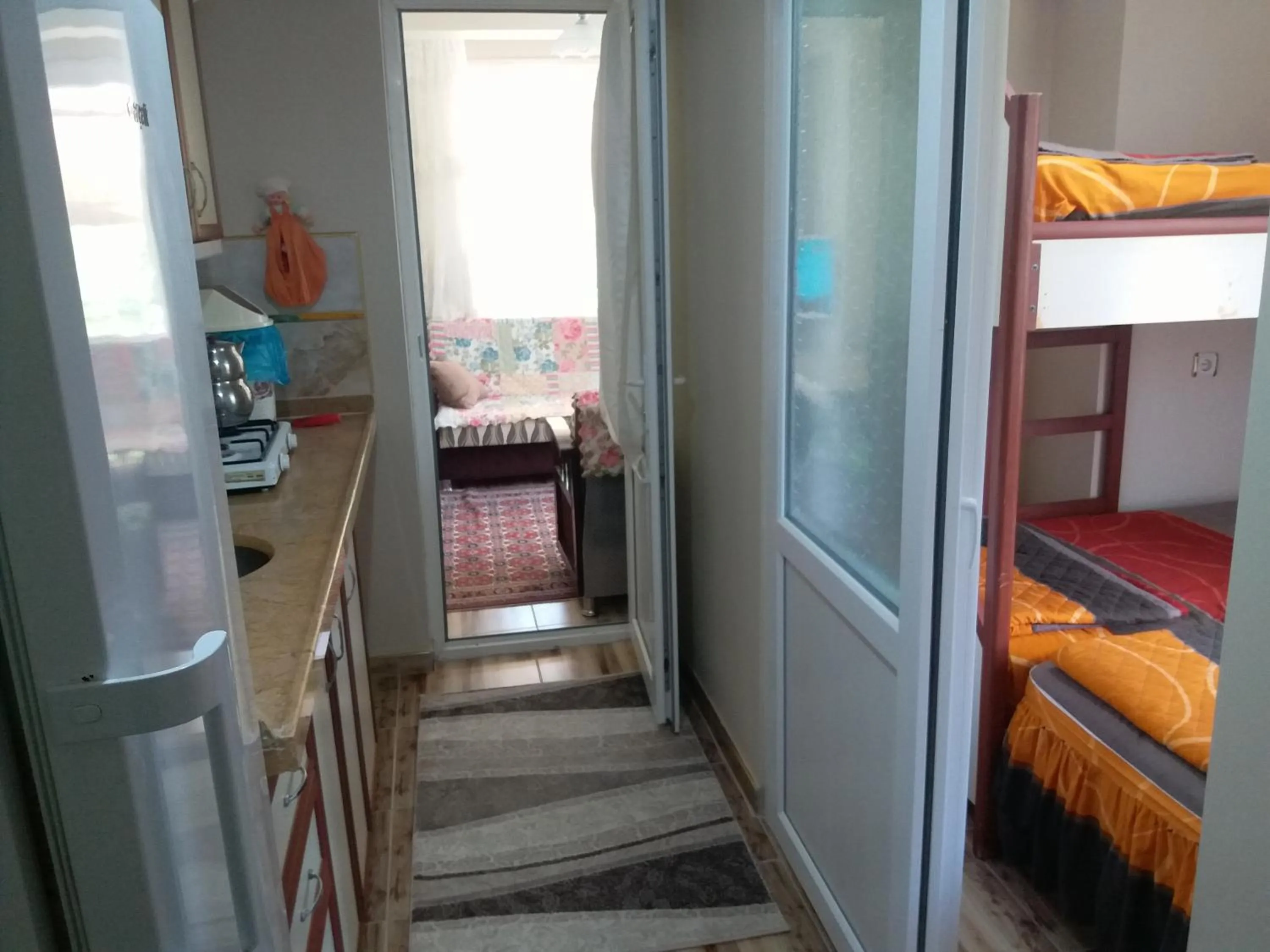 Kitchen or kitchenette, Bed in Sağlık Apart Pansiyon