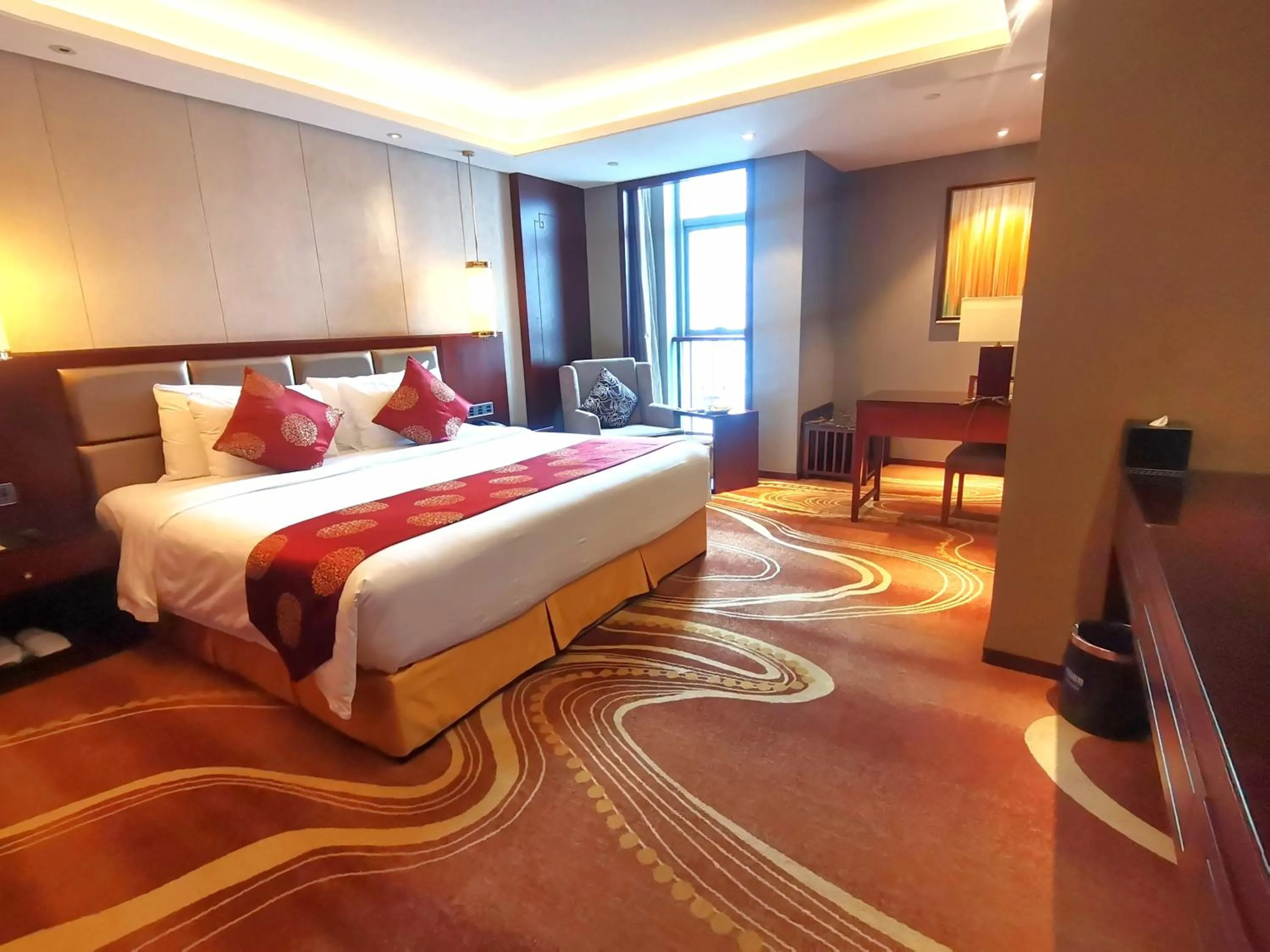 Bed in New Century Grand Hotel