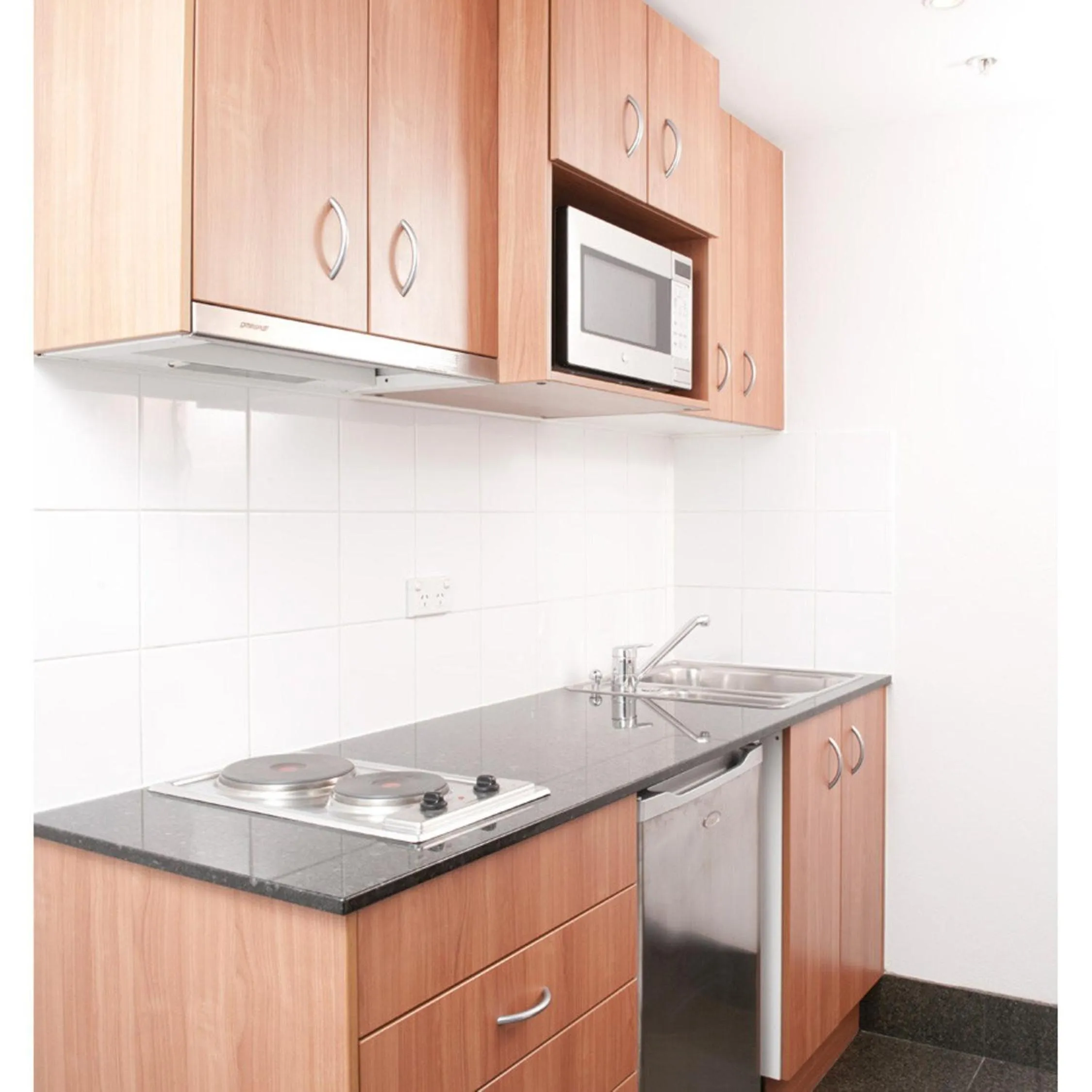 Kitchen or kitchenette in Mantra Parramatta