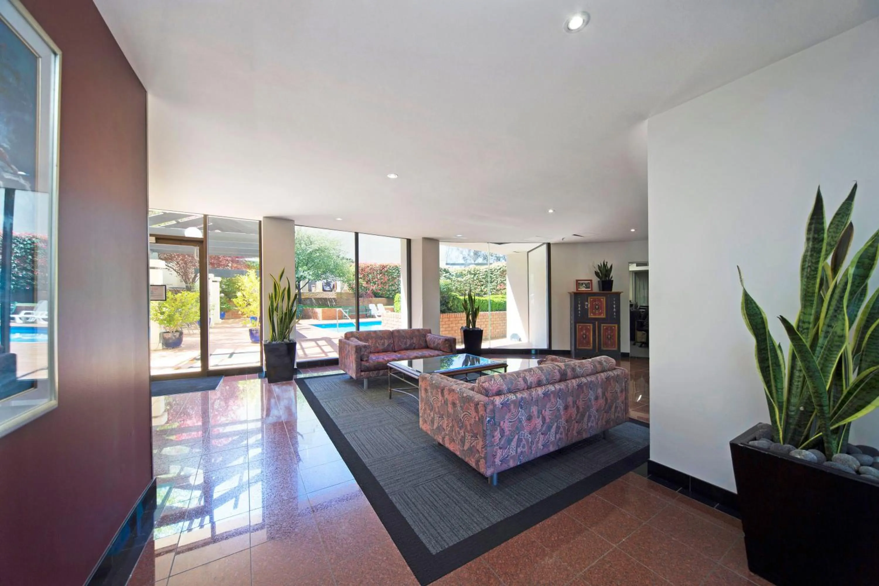 Lobby or reception, Bed in BreakFree Capital Tower Apartments