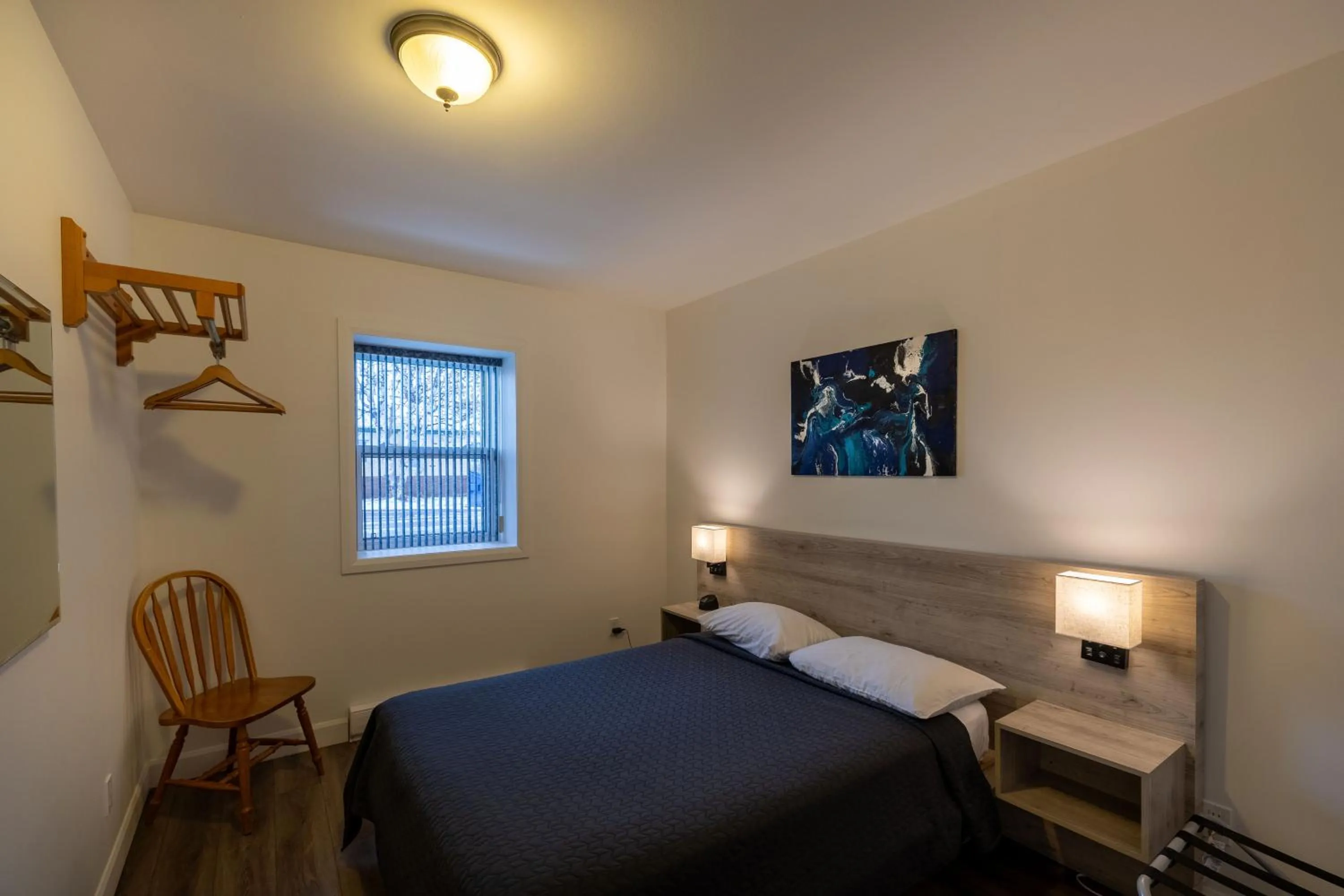 Bed in Motel Et Condo Chez Charley