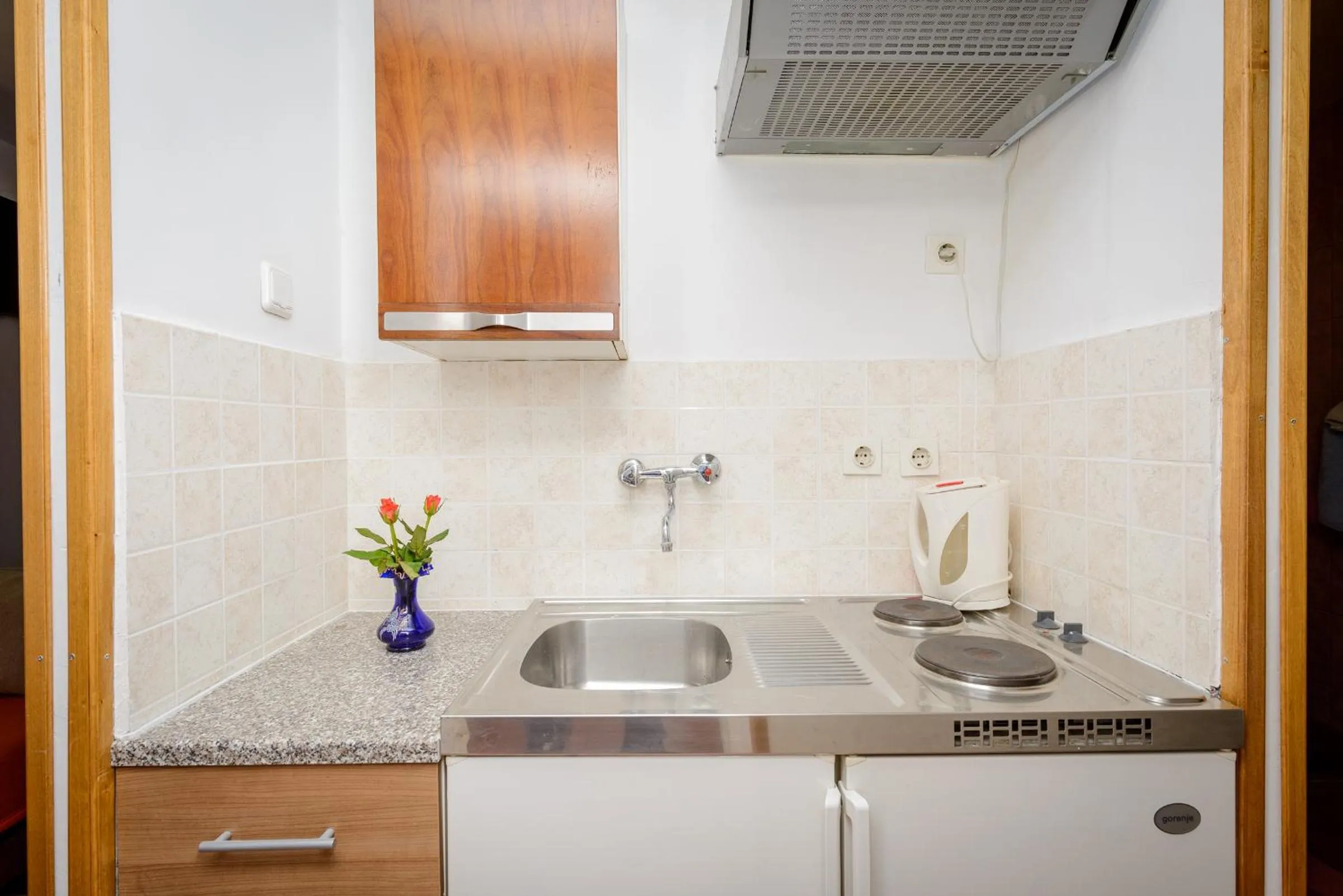 Kitchen or kitchenette in Apartments & Rooms Mihajica