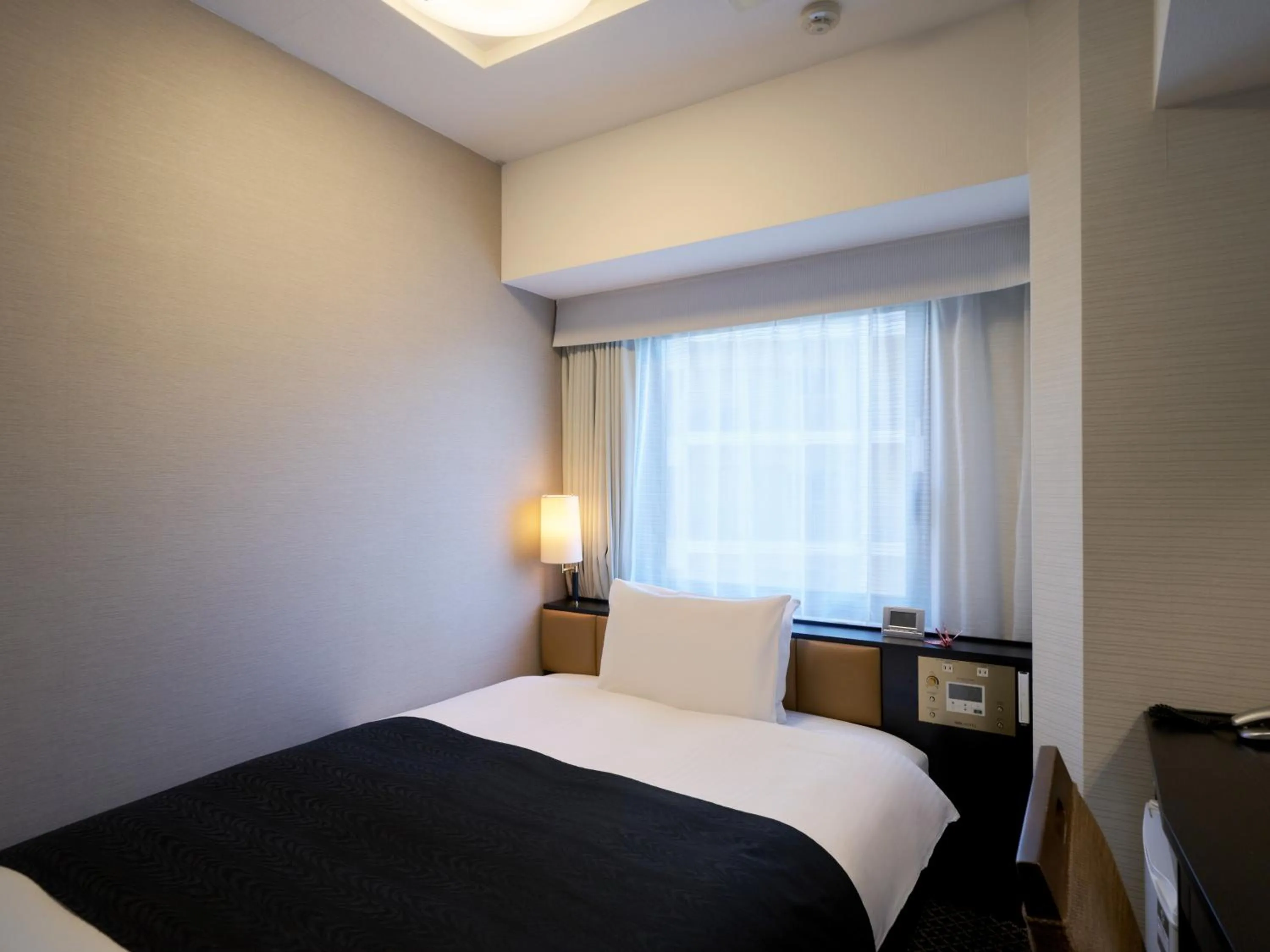 Photo of the whole room, Bed in APA Hotel Hiroshima Ekimae Ohashi