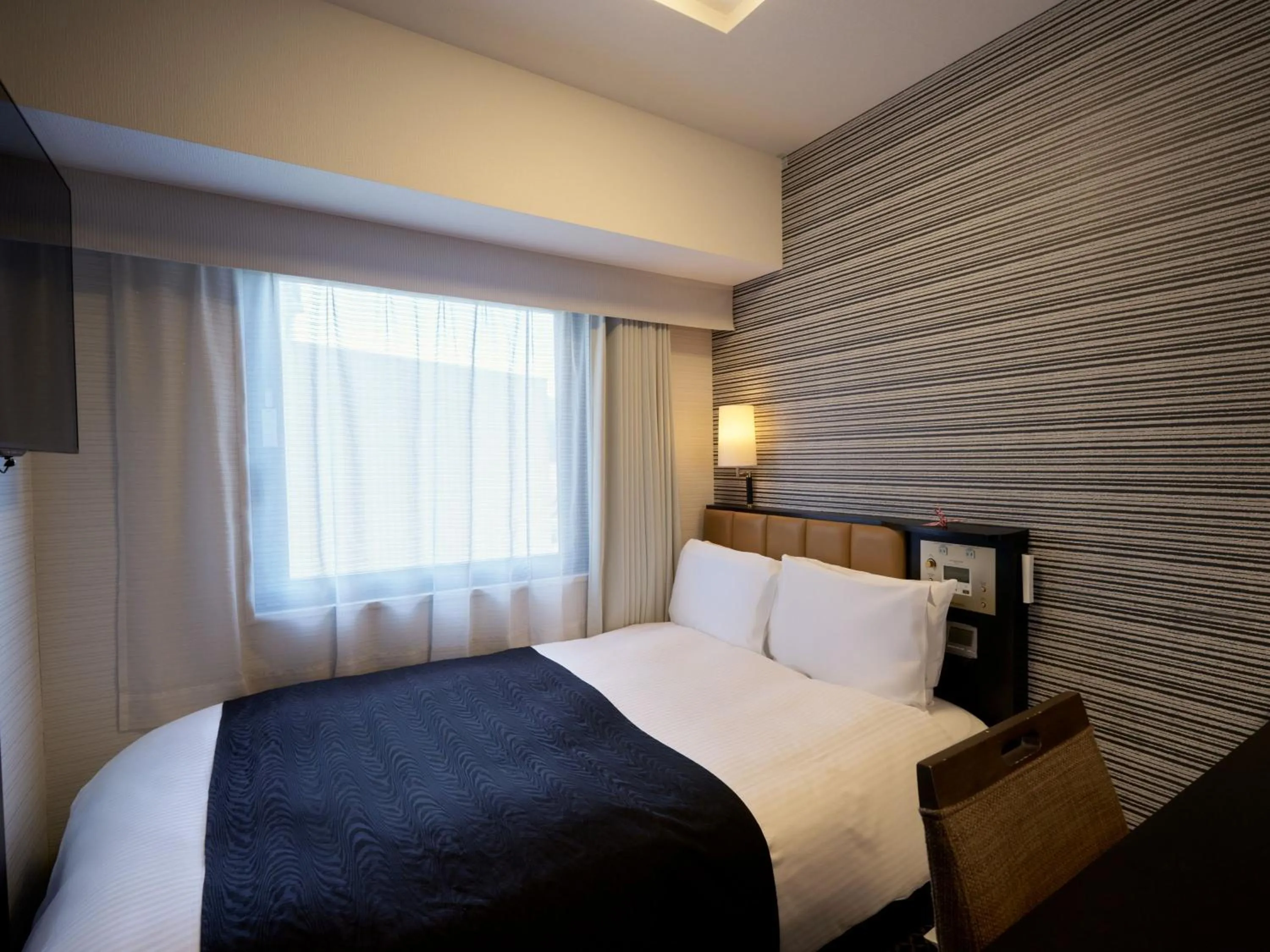 Photo of the whole room, Bed in APA Hotel Hiroshima Ekimae Ohashi