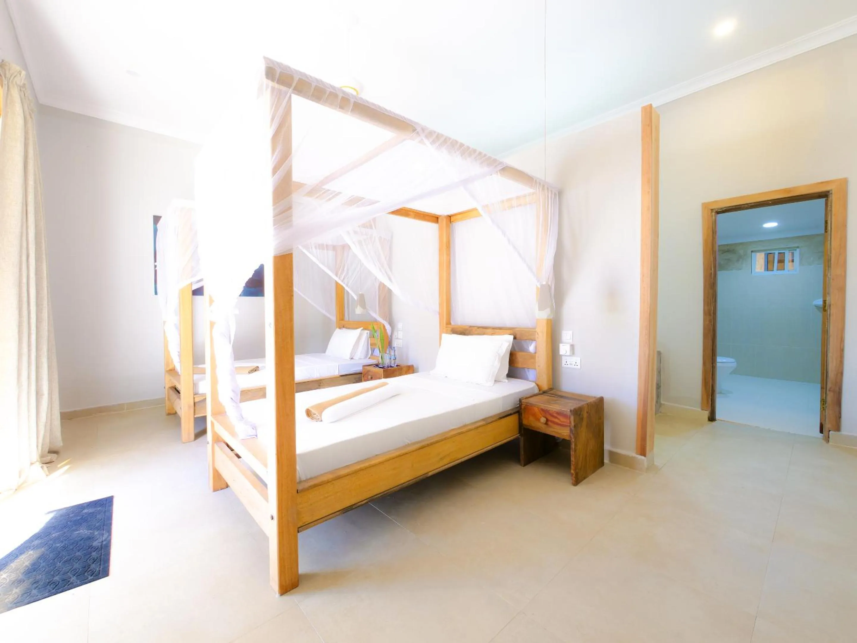Bathroom, Bed in Paje Beach Apartments & Hotel