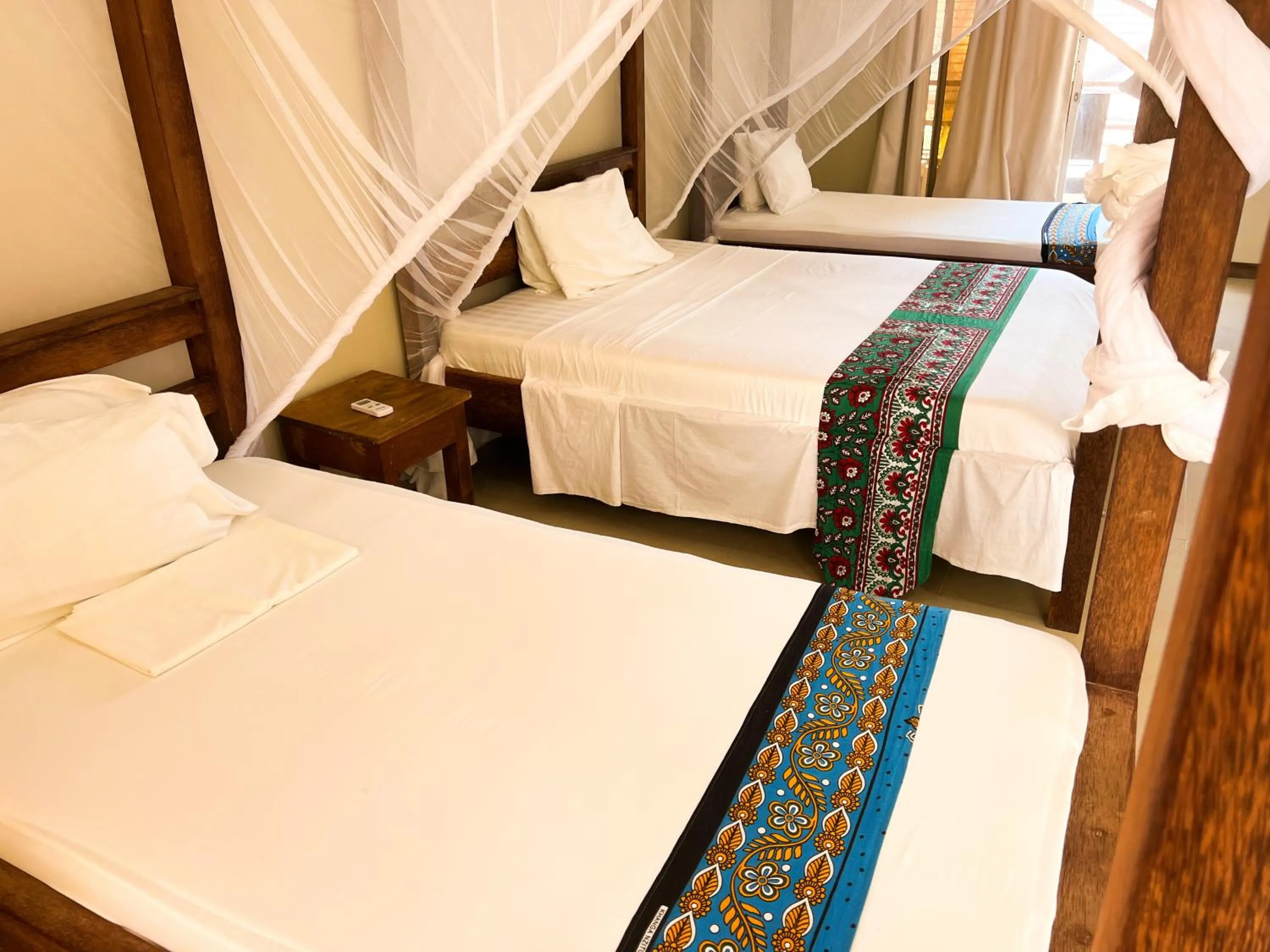 Bed in Paje Beach Apartments & Hotel