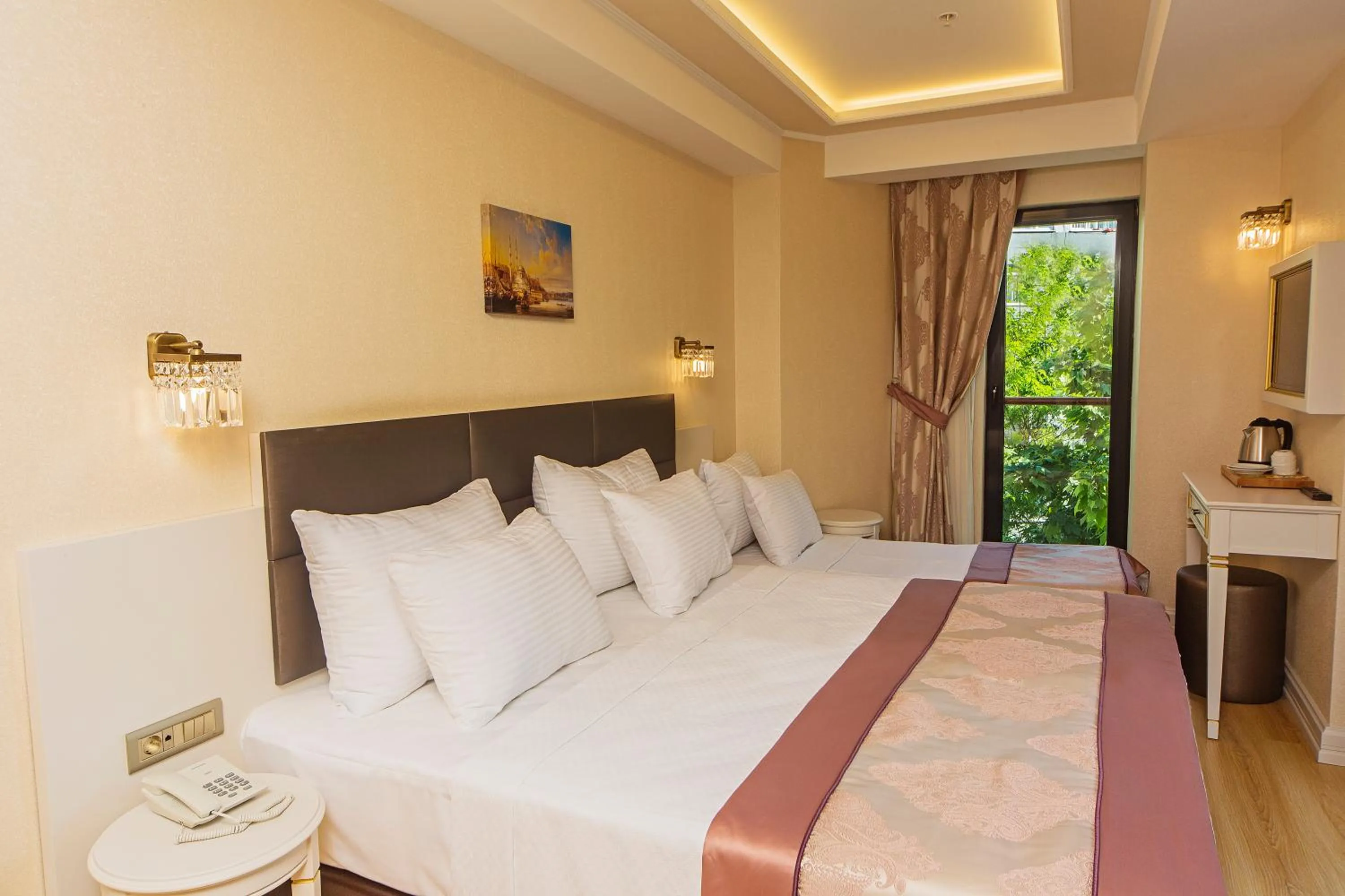 Bed in Grand Naki Hotel