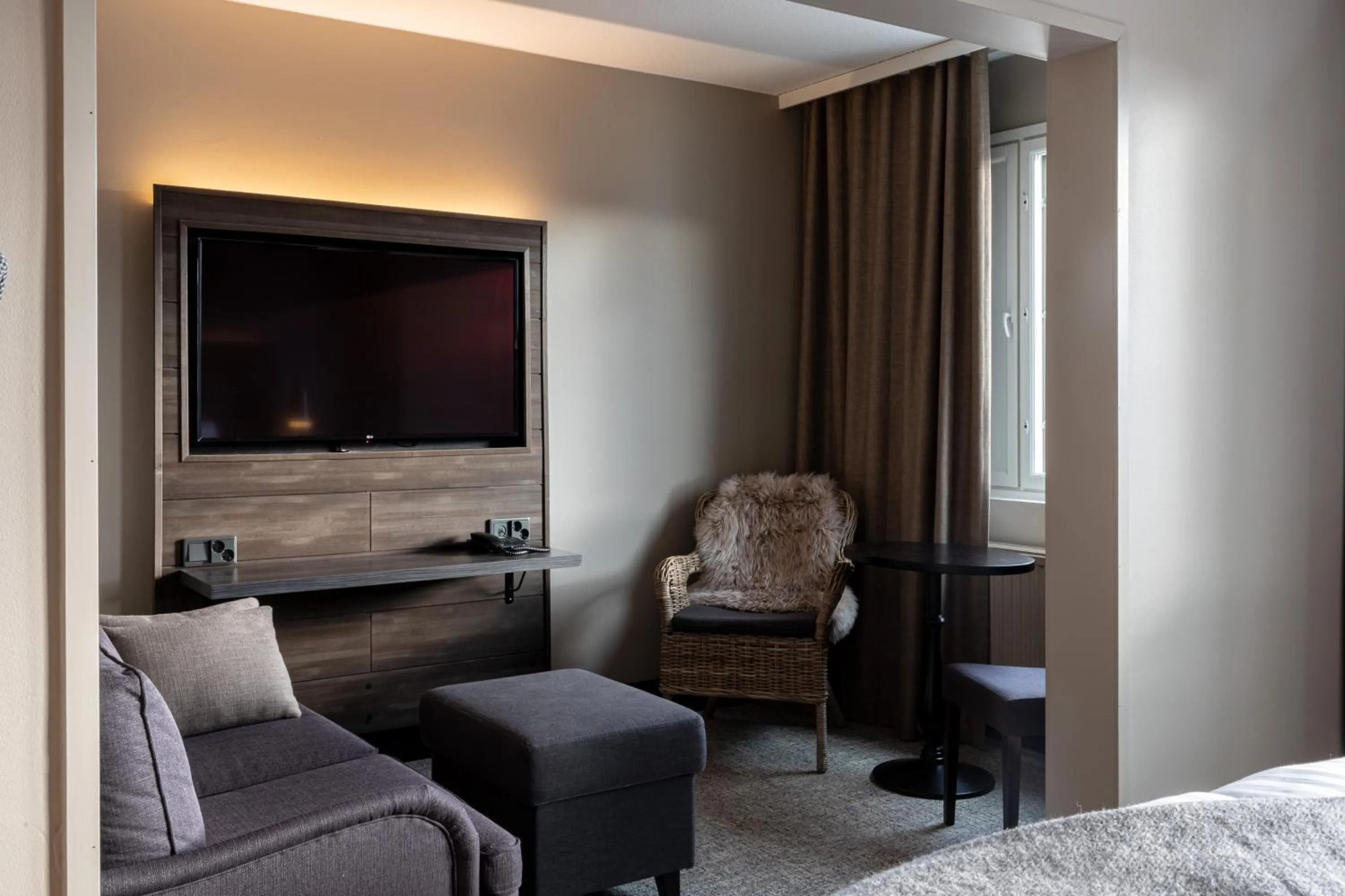 Living room, Bed in Lapland Hotels Kuopio