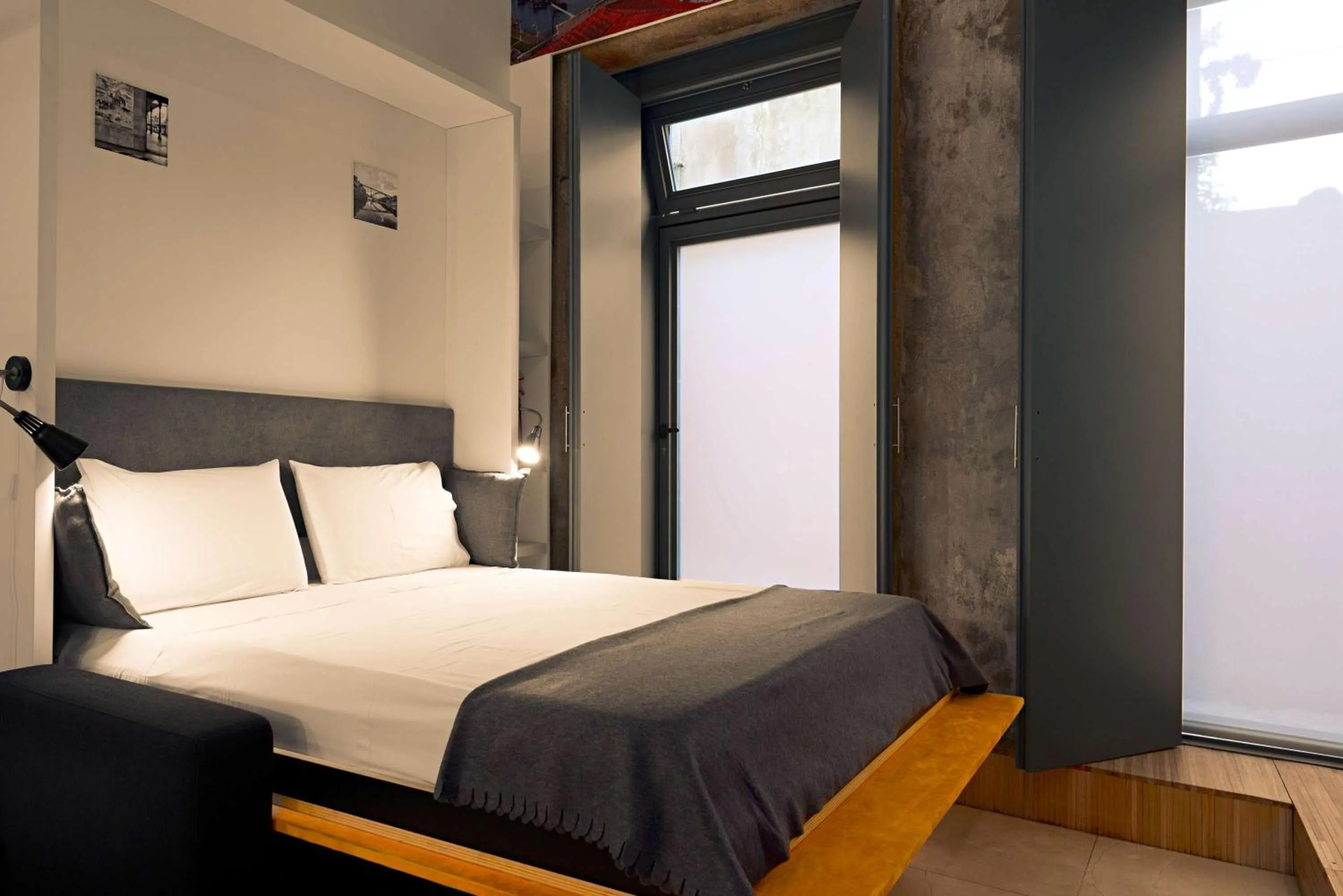 Bed in Cathedral Design Apartments