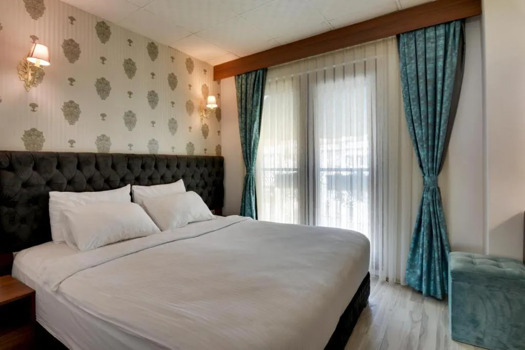 Bed in Grande Stella Hotel