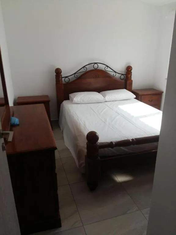 Bed in Christopher's Sandy Beach Suites