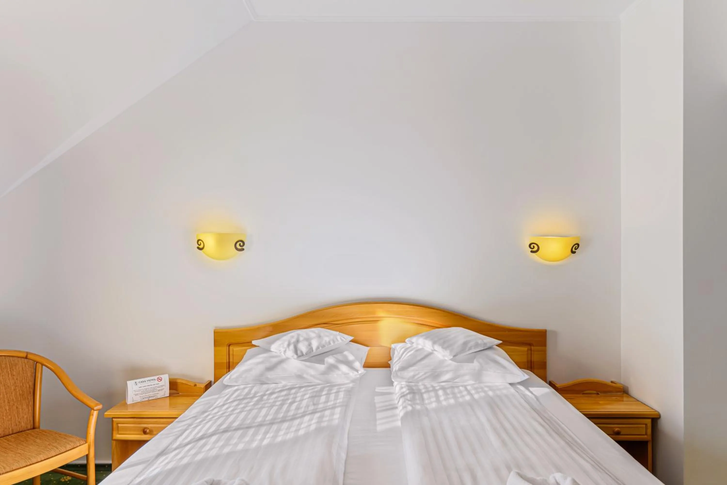 Bed in Hotel Casa Viorel jacuzzi & saunas