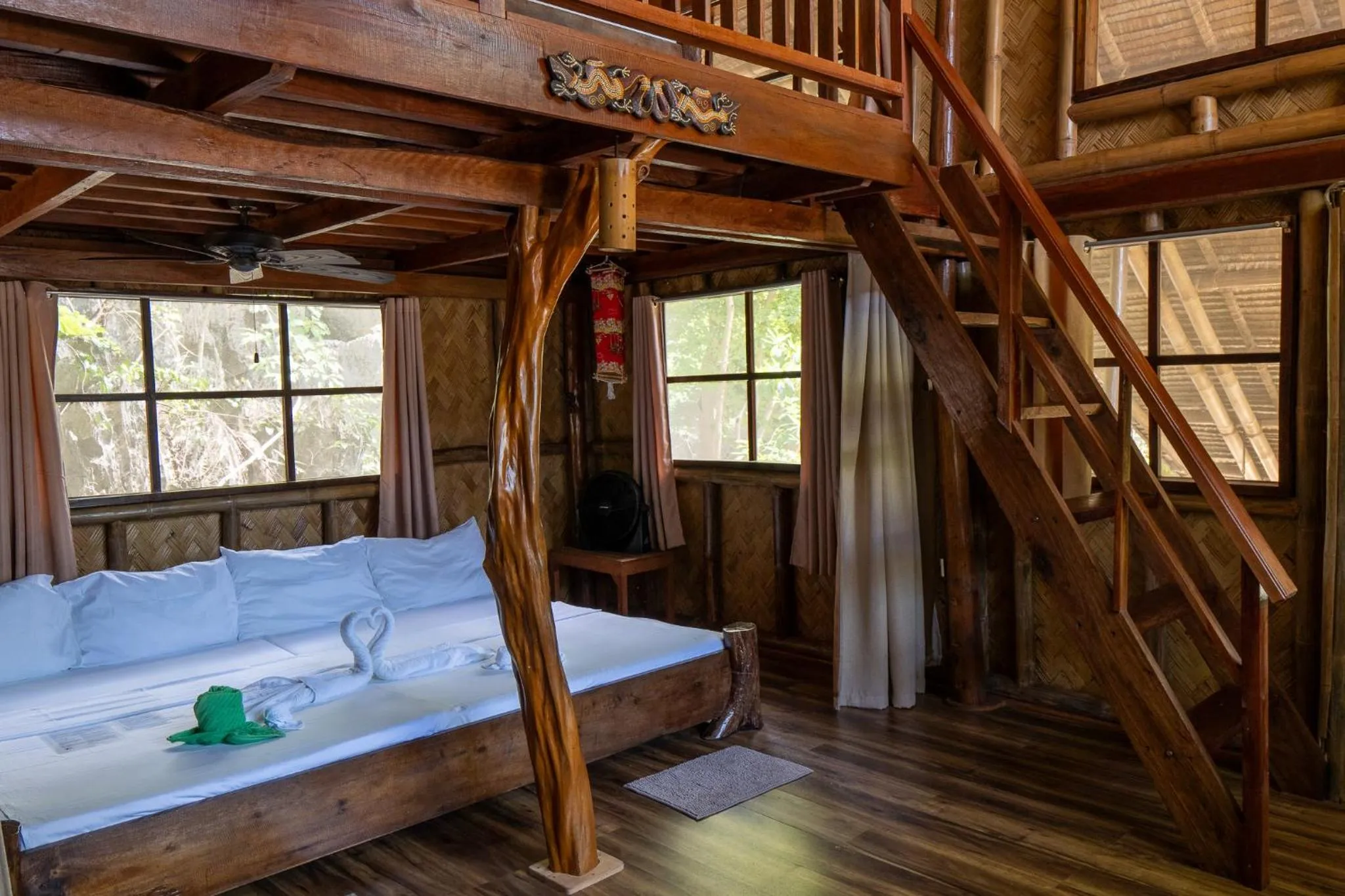 Bed in Sangat Island Dive Resort