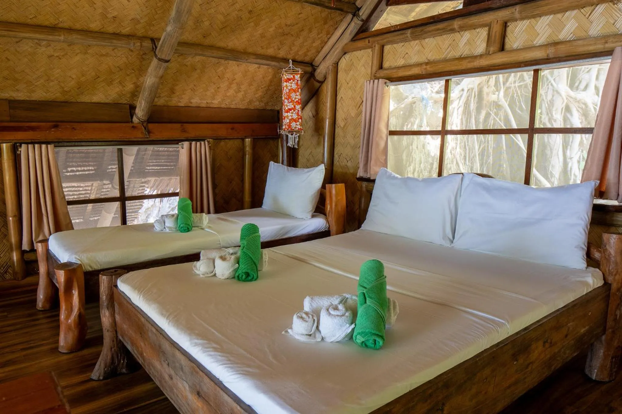 Bed in Sangat Island Dive Resort