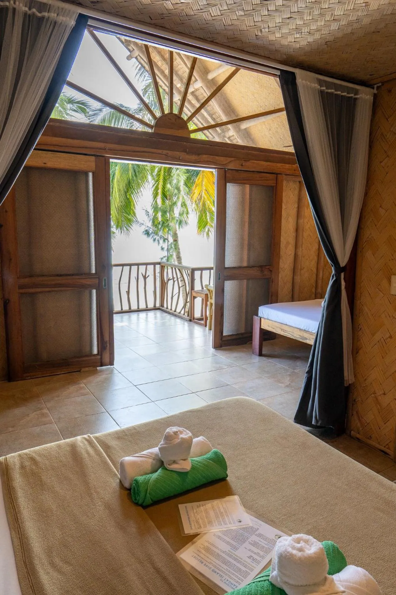 Bed in Sangat Island Dive Resort