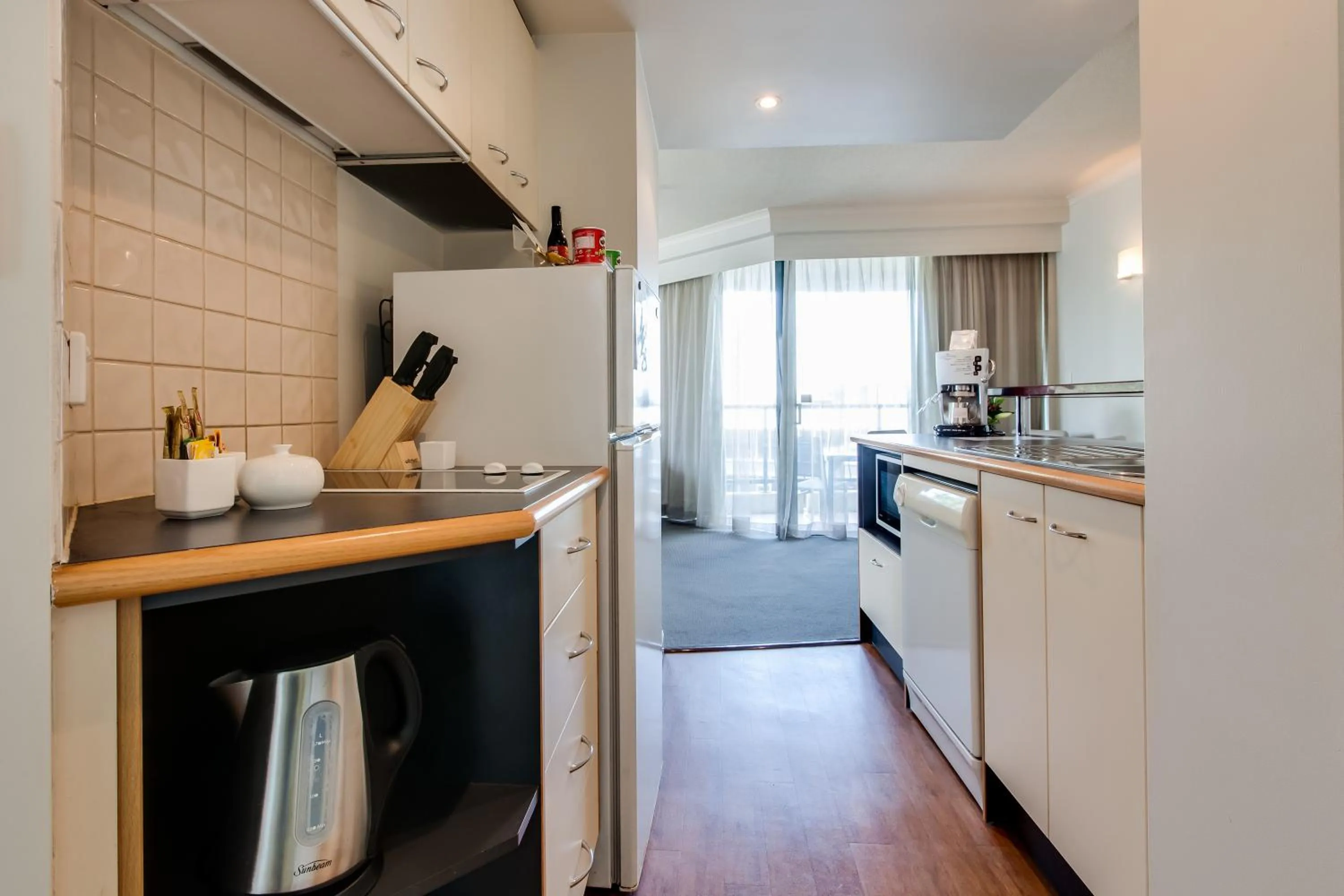 Kitchen or kitchenette in Cosmo Apartment Hotel