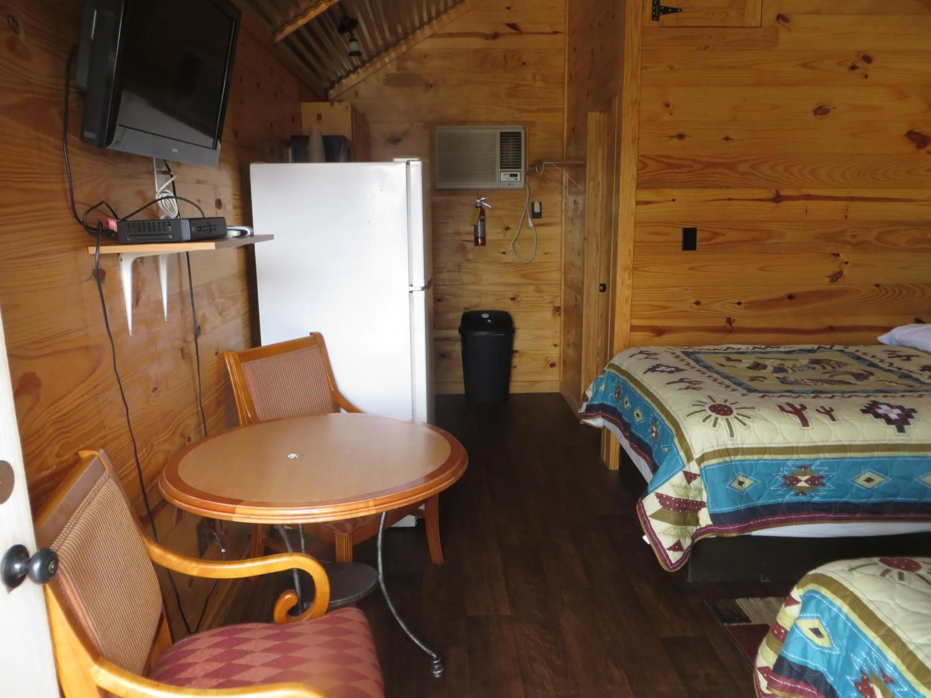 Bed in All Tucked Inn Cabins