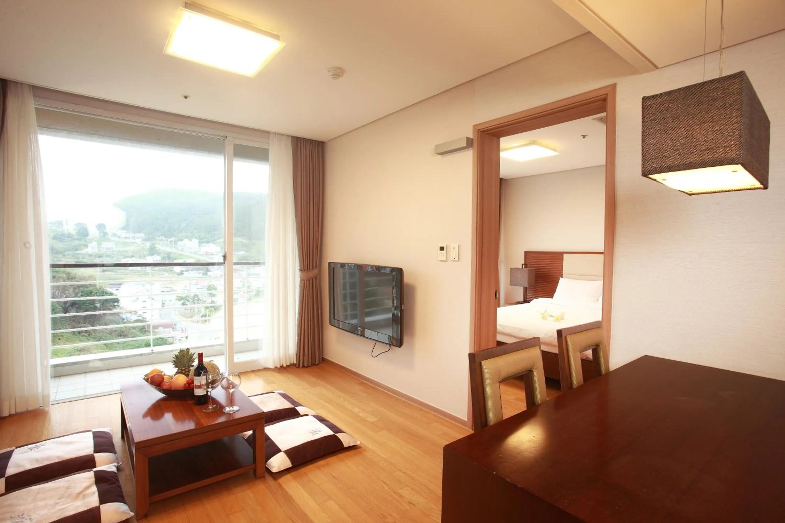 Kitchen or kitchenette, Bed in Hotel Riviera Geoje