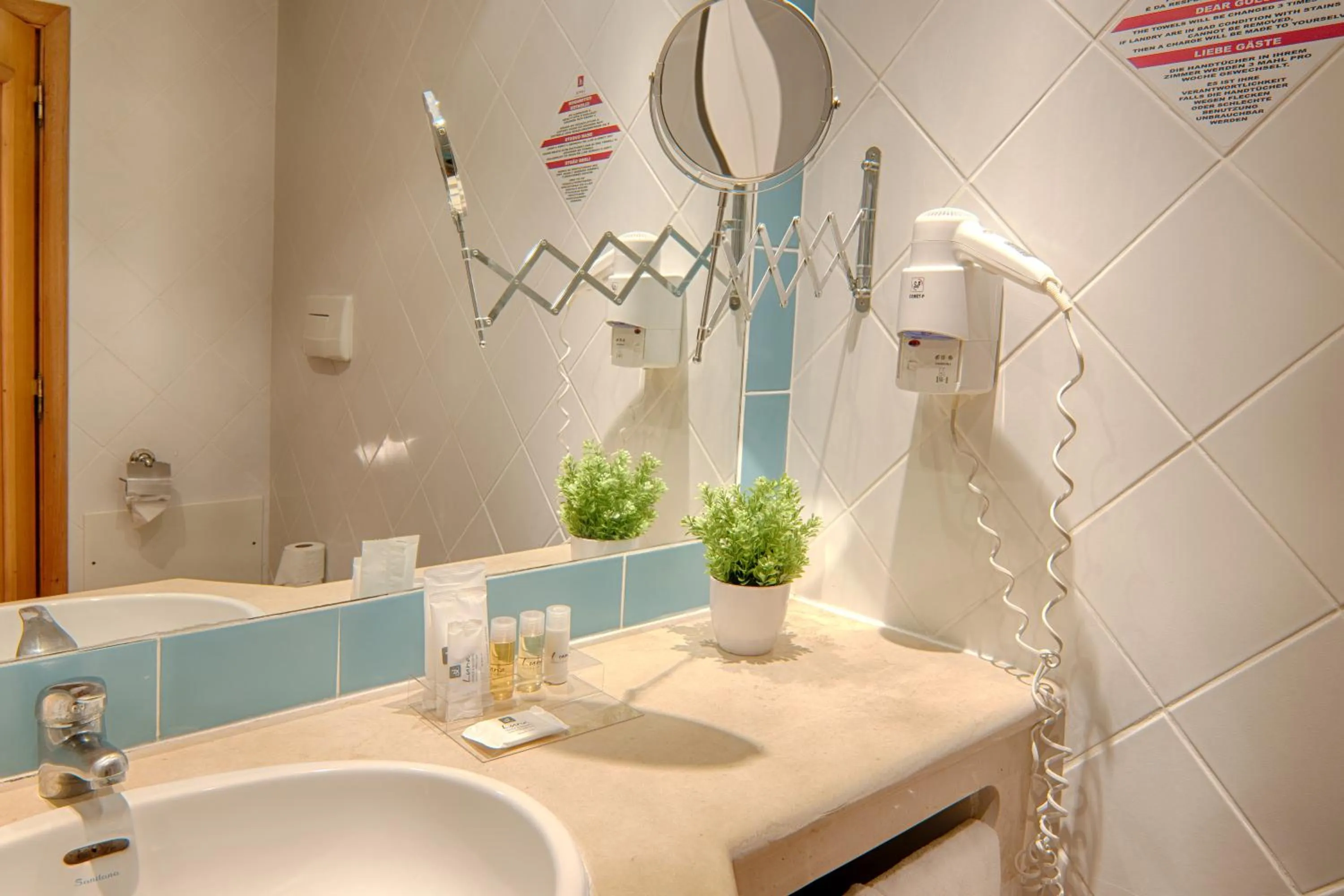 Toilet in Luna Miramar Club