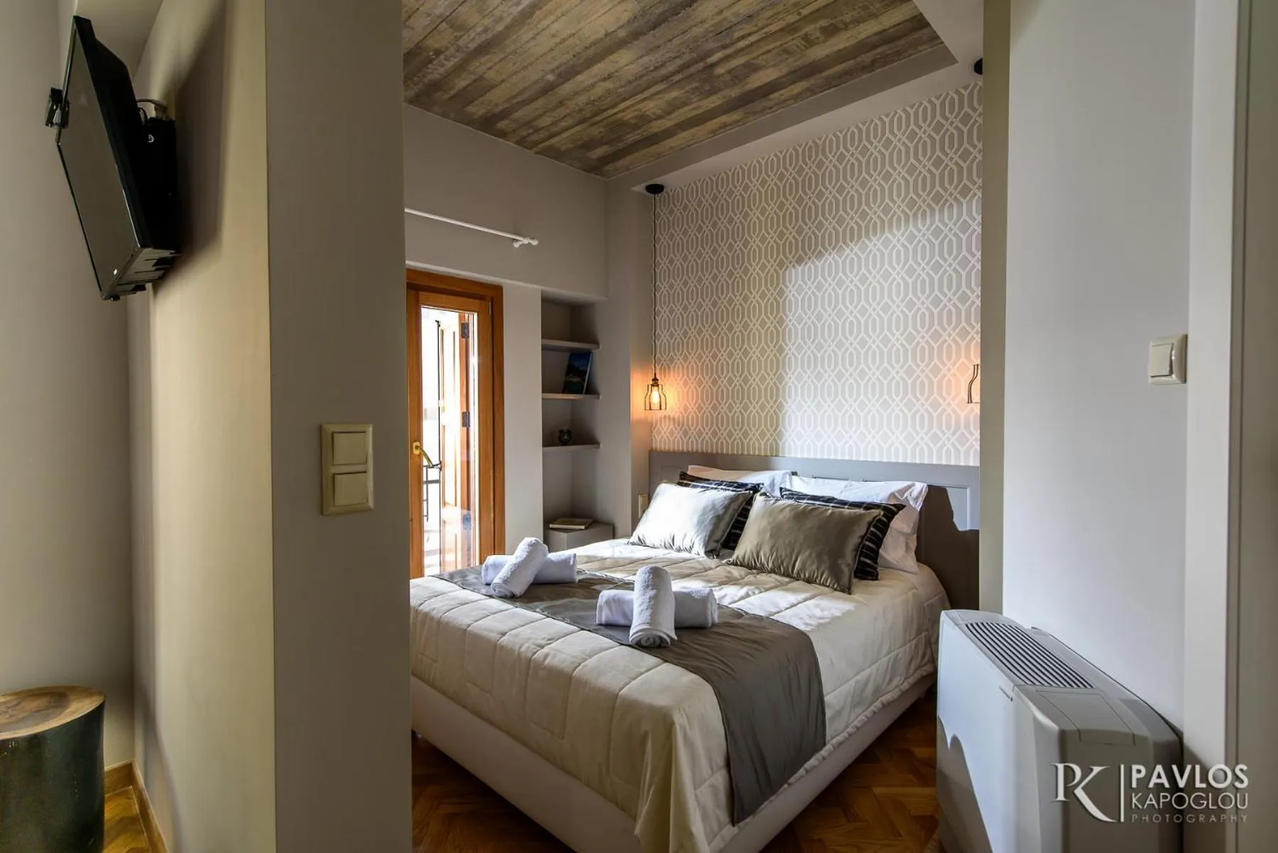 Bed in Candia Suites & Rooms