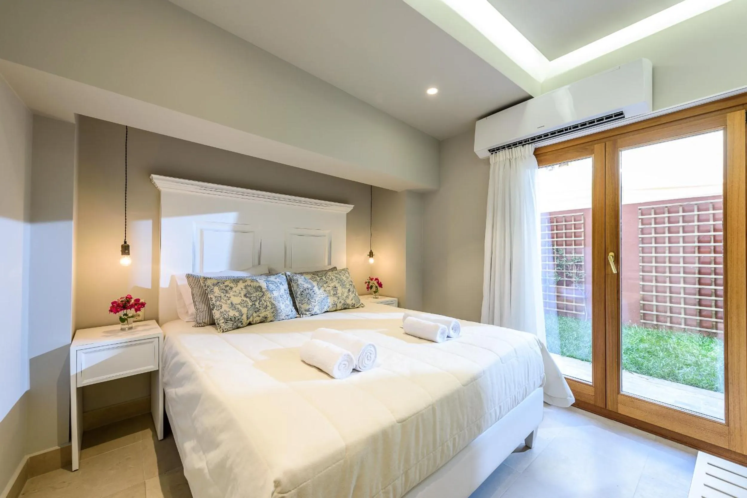 Bed in Candia Suites & Rooms